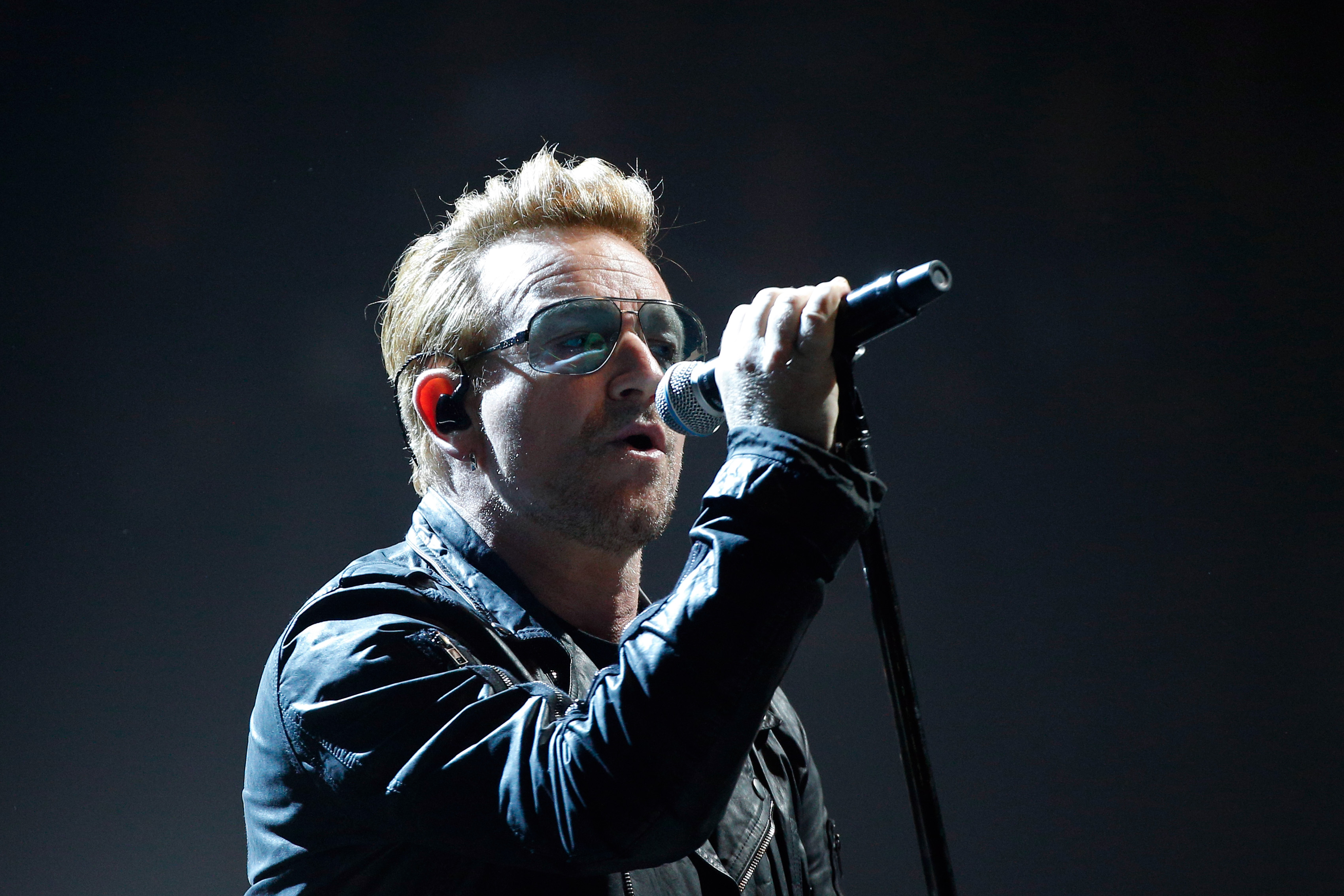 Bono of U2 performs on stage during a concert, in Paris, Dec. 6, 2015 (Thibault Camus—AP)