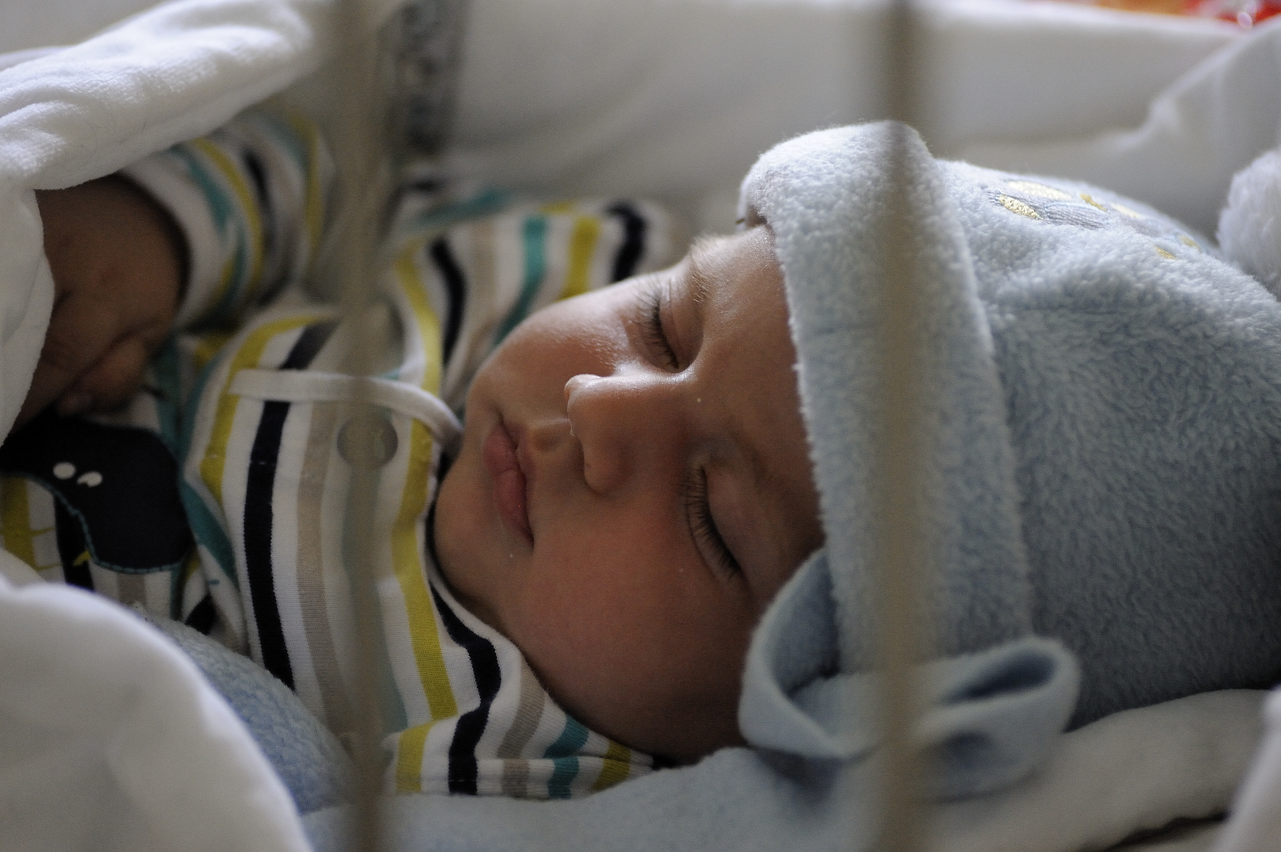 A baby sleeps under a blanket at the reception centre for refugees and migrants, in the town of Šid, on the border with Croatia. The reception centre provides access to support services and offers refugee and migrant children and families the opportunity to rest during their arduous journey.
