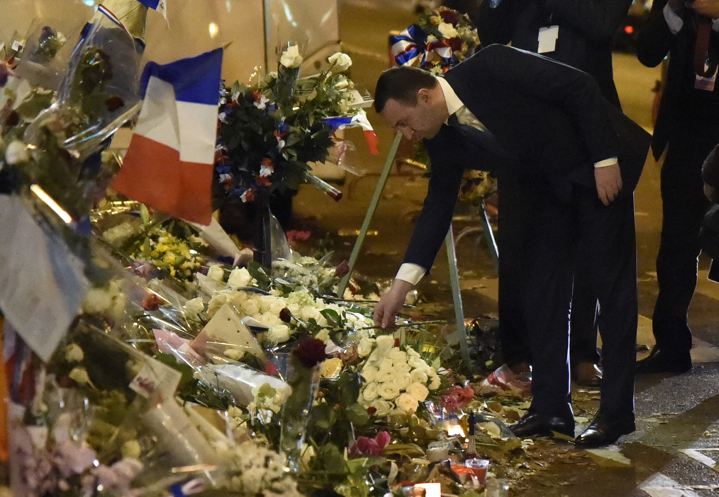 Georgia's Prime Minister Irakli Garibashvili pays tribute to the victims of the November 13 terrorist attacks at a makeshift memorial in front of the Bataclan music hall in Paris, on November 30, 2015.
