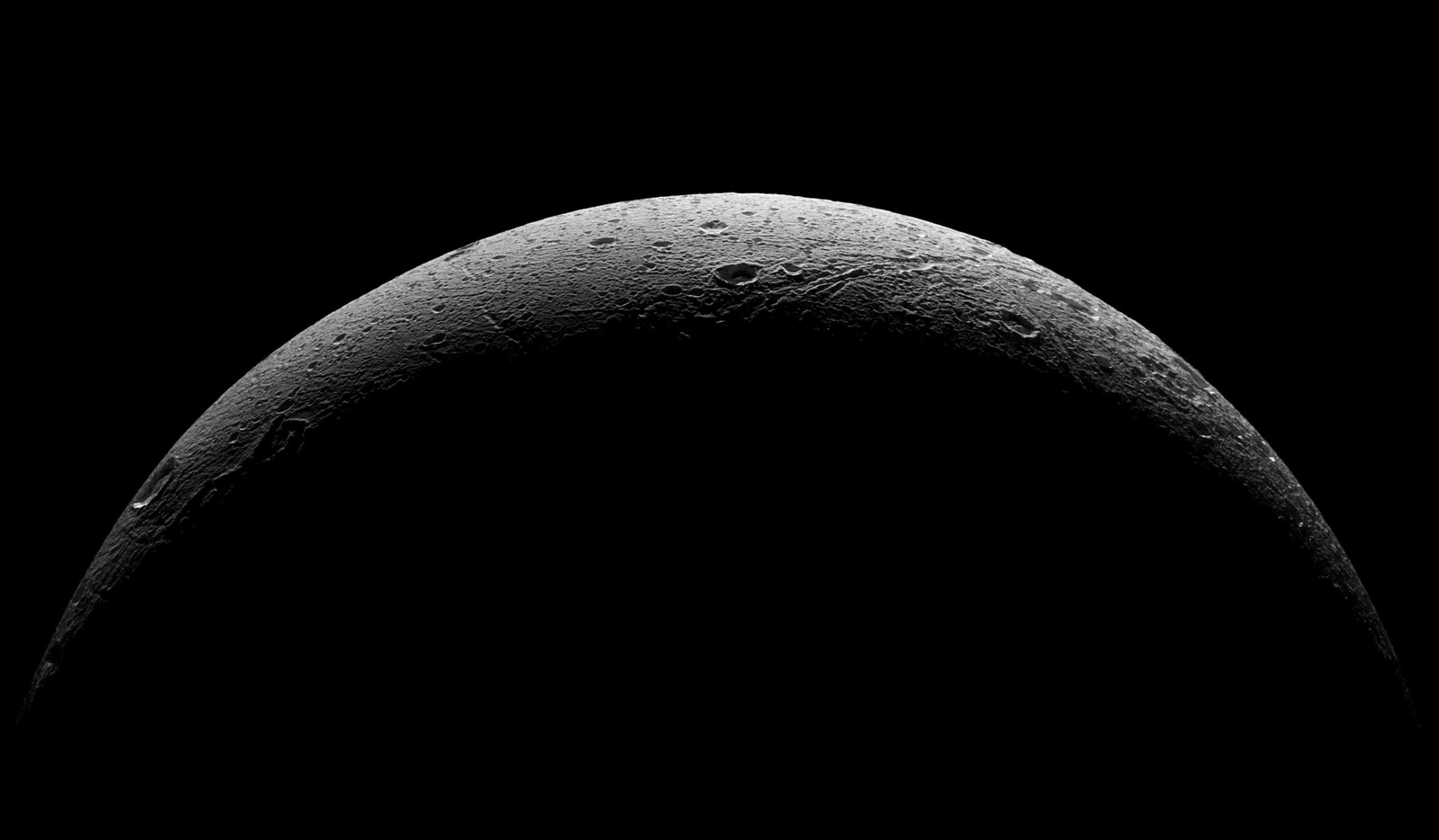 NASA's Cassini spacecraft captured this parting view showing the rough and icy crescent of Saturn's moon Dione following the spacecraft's last close flyby of the moon on Aug. 17, 2015. Five visible light, narrow-angle camera images were combined to create this mosaic view. The view was acquired at distances ranging from approximately 37,000 miles to 47,000 miles from Dione and at a sun-Dione-spacecraft angle of 145 degrees.