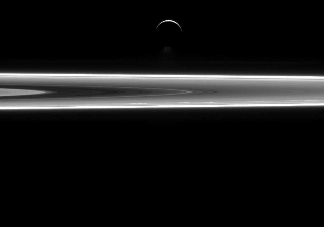 Saturn's icy moon Enceladus and a small stretch of Saturn's rings, as seen by the Cassini spacecraft on July 29, 2015.