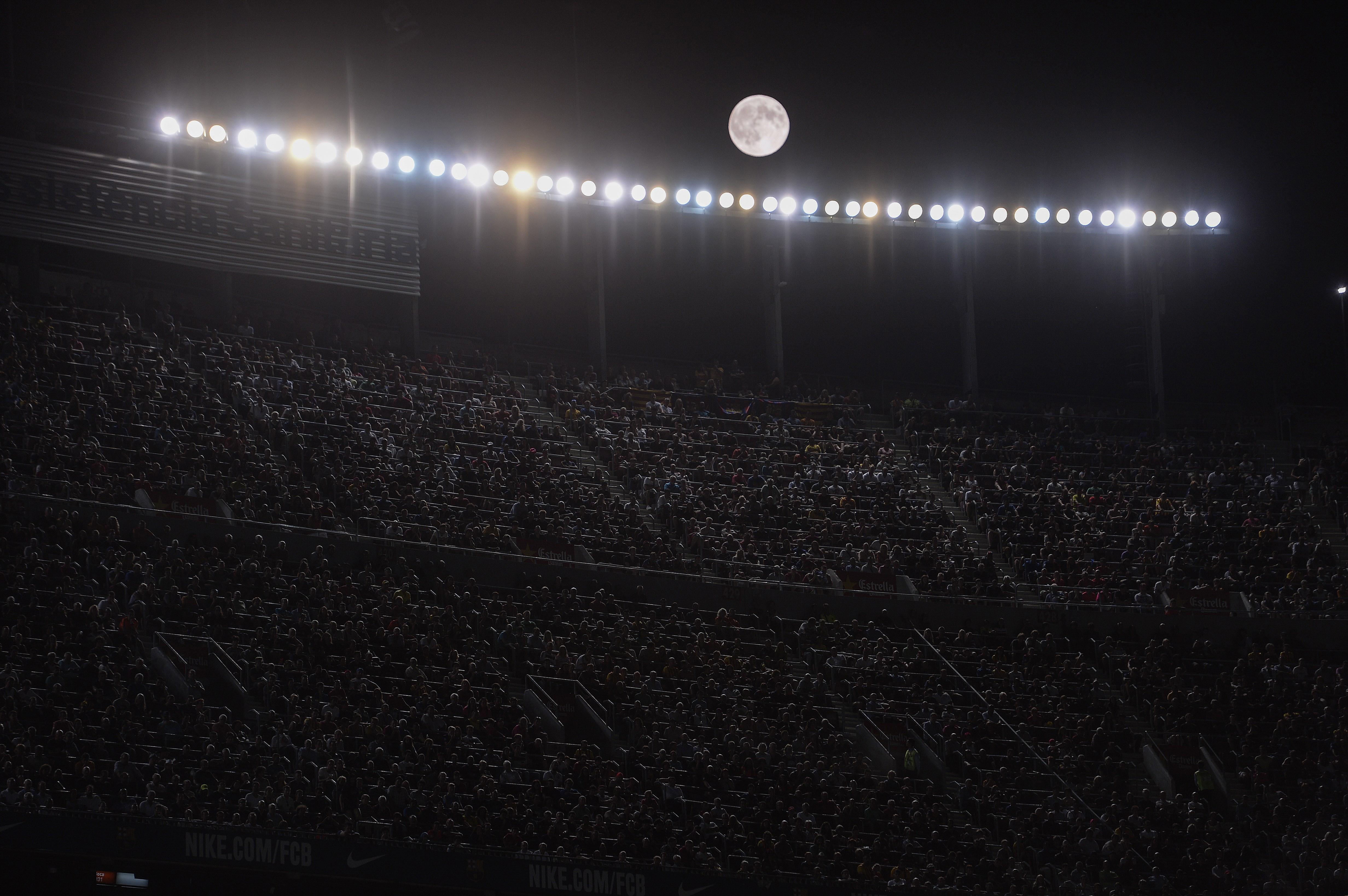 The moon shines during the Spanish league football match FC Barcelona vs. Malaga CF at the Camp Nou stadium in Barcelona on Aug. 29, 2015.
