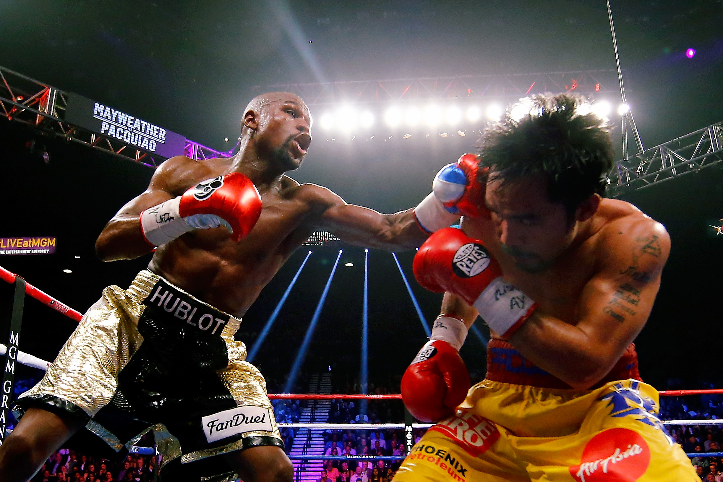 Floyd Mayweather Jr. throws a punch at Manny Pacquiao during their welterweight unification championship bout on May 2, 2015 in Las Vegas.