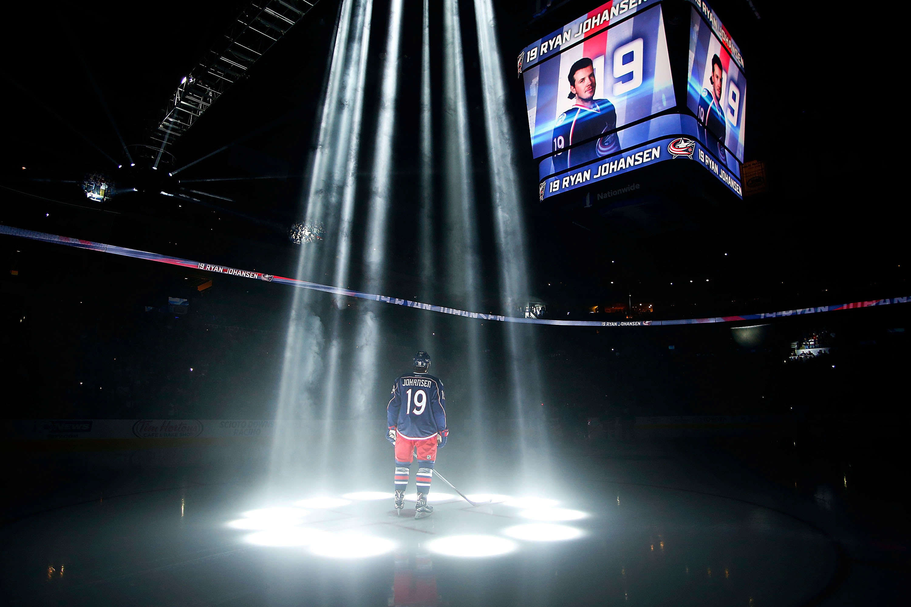 Columbus Bluejackets' Ryan Johansen is illuminated by spotlights before an NHL hockey game against the New York Rangers on Oct. 9, 2015 in Columbus, Ohio.