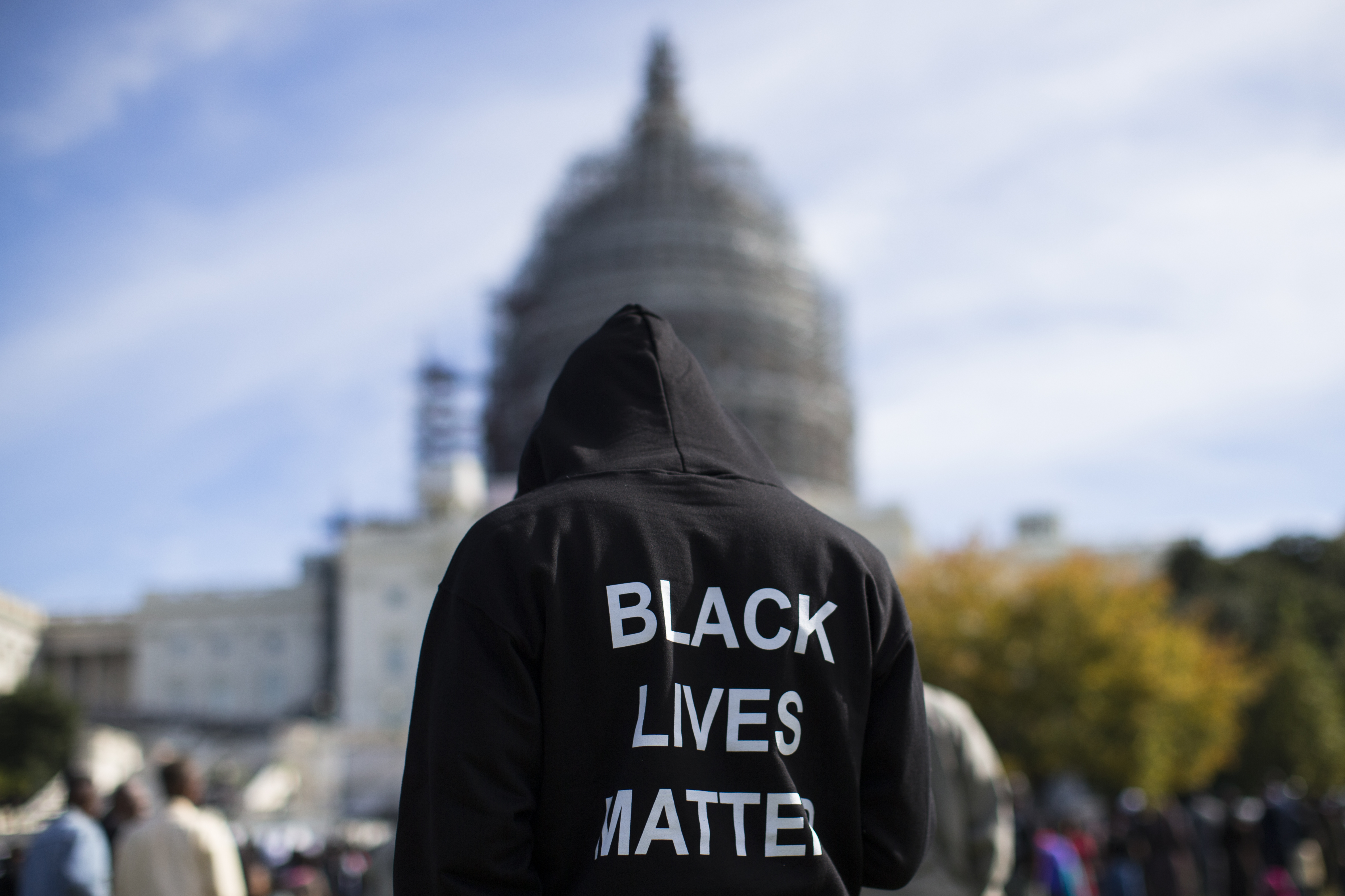 Neal Blair, of Augusta, Ga. stands on the lawn of the Capitol building during a rally to mark the 20th anniversary of the Million Man March, on Capitol Hill, on Oct. 10, 2015, in Washington. (Evan Vucci—AP)