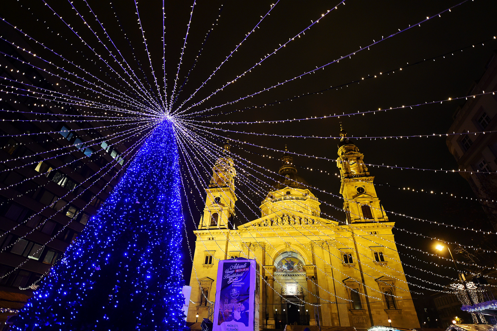 A Christmas tree is lit in front of the St, Stephan Basilica in Budapest on Dec. 21, 2015.
