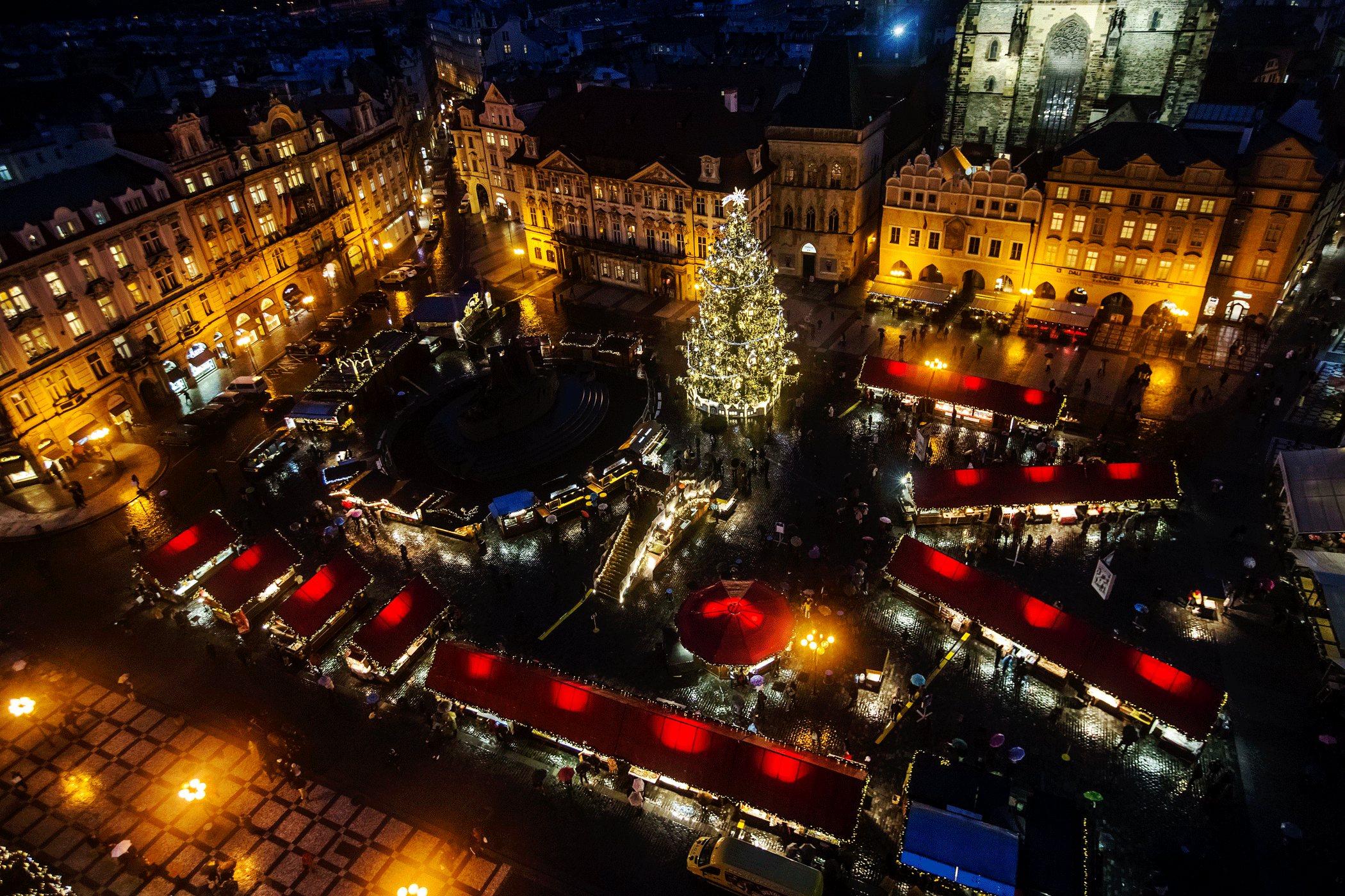 The Old Town Square and Christmas tree are illuminated at the Christmas market in Prague on Nov. 30, 2015.