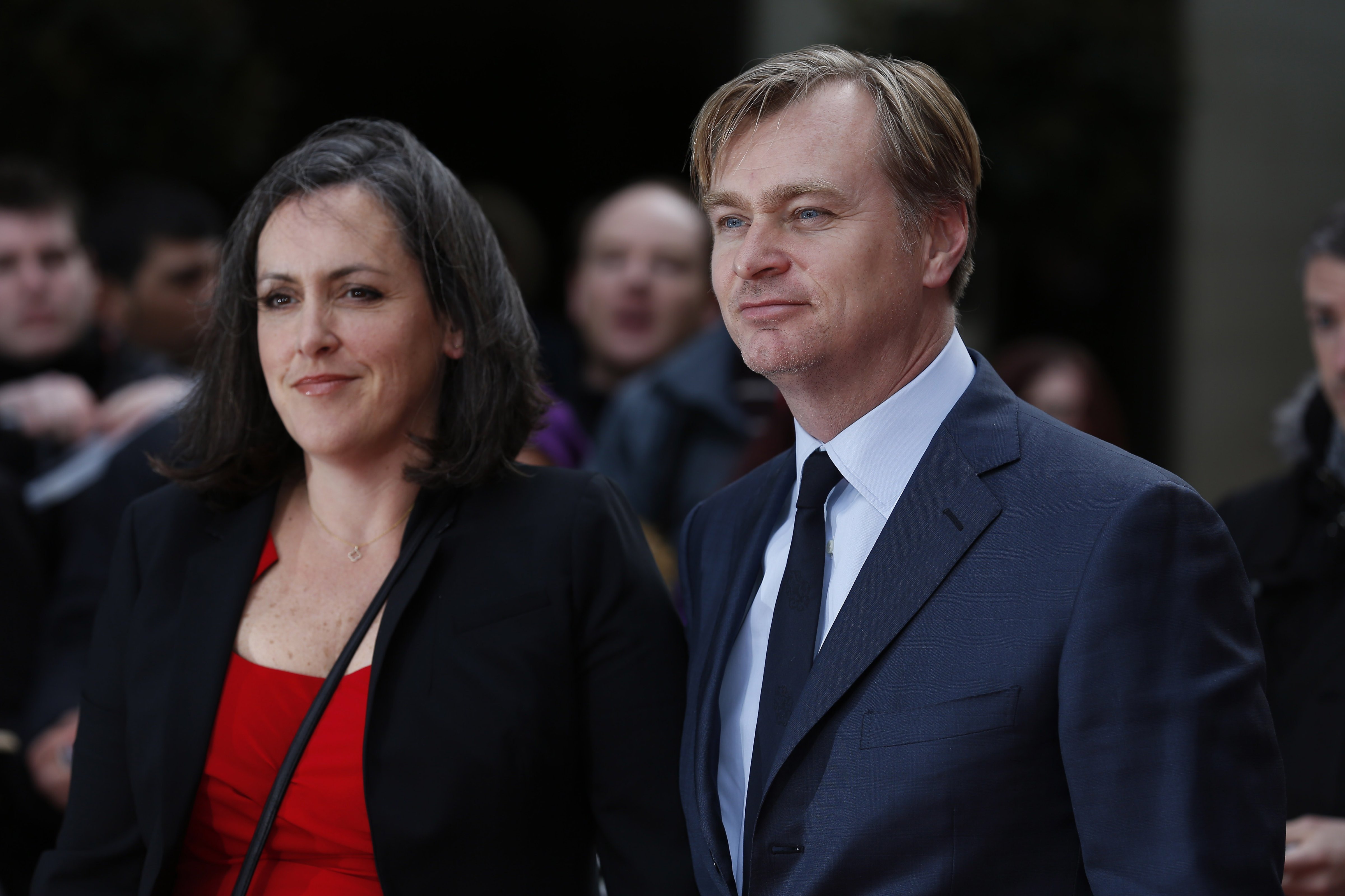 British director Christopher Nolan (R) and his wife, British film producer Emma Thomas pose for photographers as they arrive for the 2015 Empire Awards in central London on Mar. 29, 2015. (Justin Tallis—AFP/Getty Images)