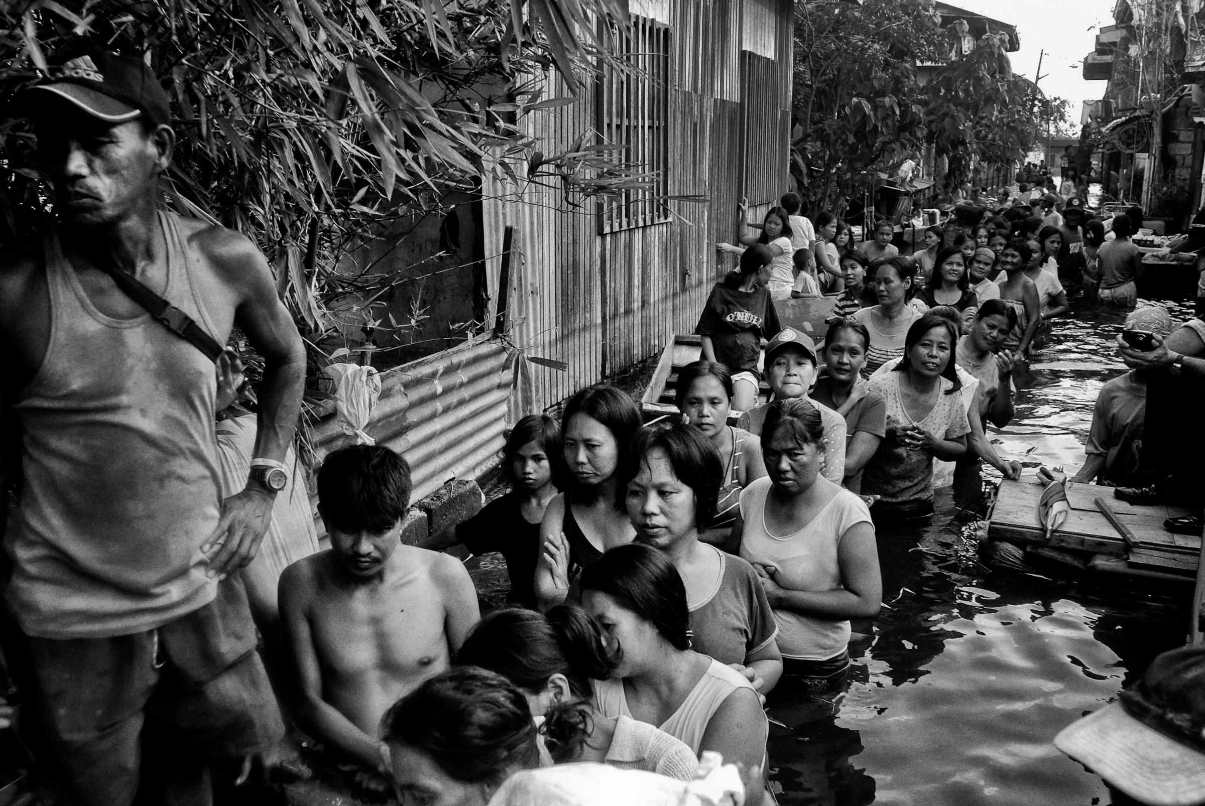 Relief packs are distributed in a flooded district of Taguig, Phillipines on Oct. 12, 2009. Typhoon Ketsana, known in the Philippines as Tropical Storm Ondoy, devastated the region in 2009.