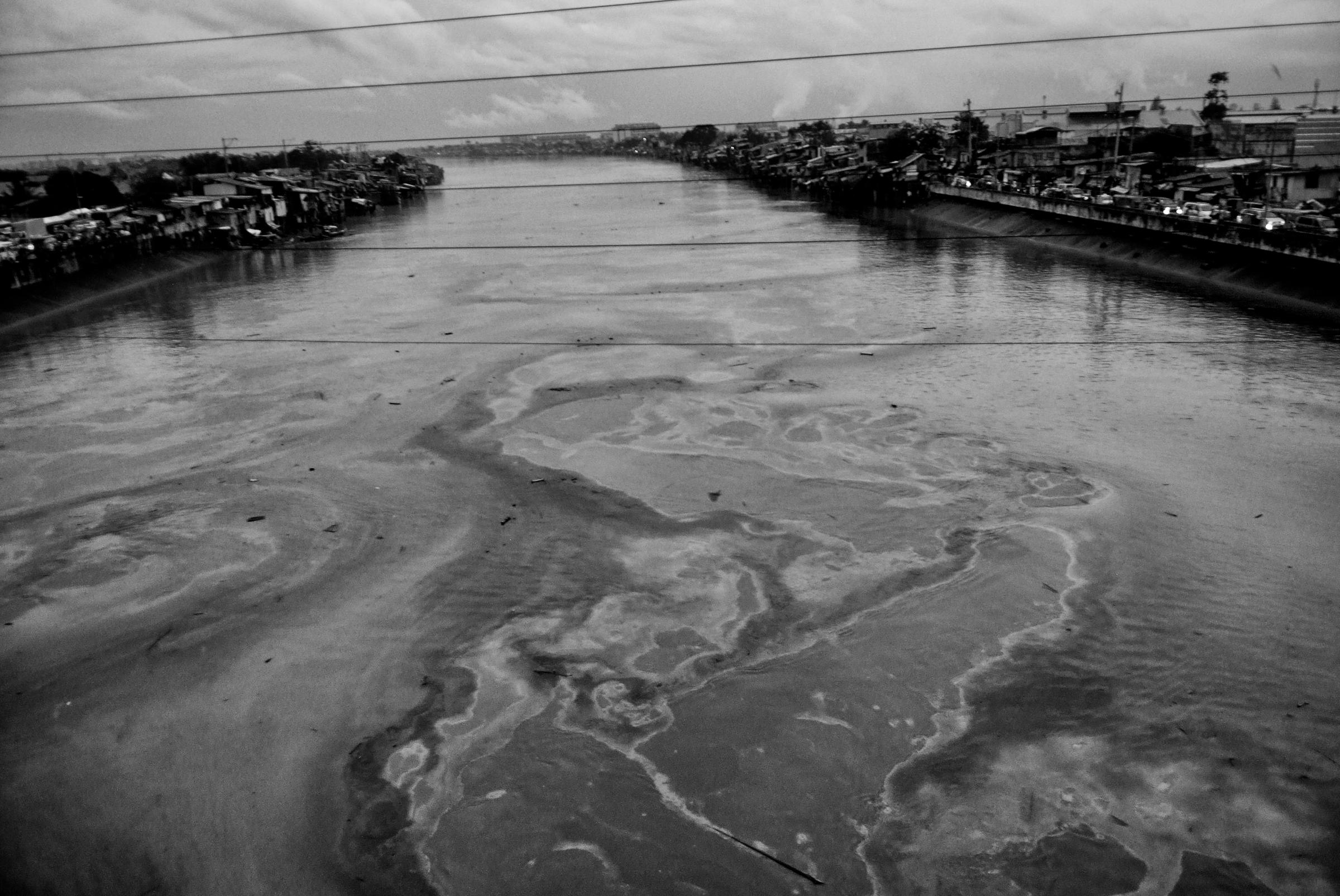 Pollution is visible on the Pasig River following Typhoon Ketsana on Sept. 28, 2009.