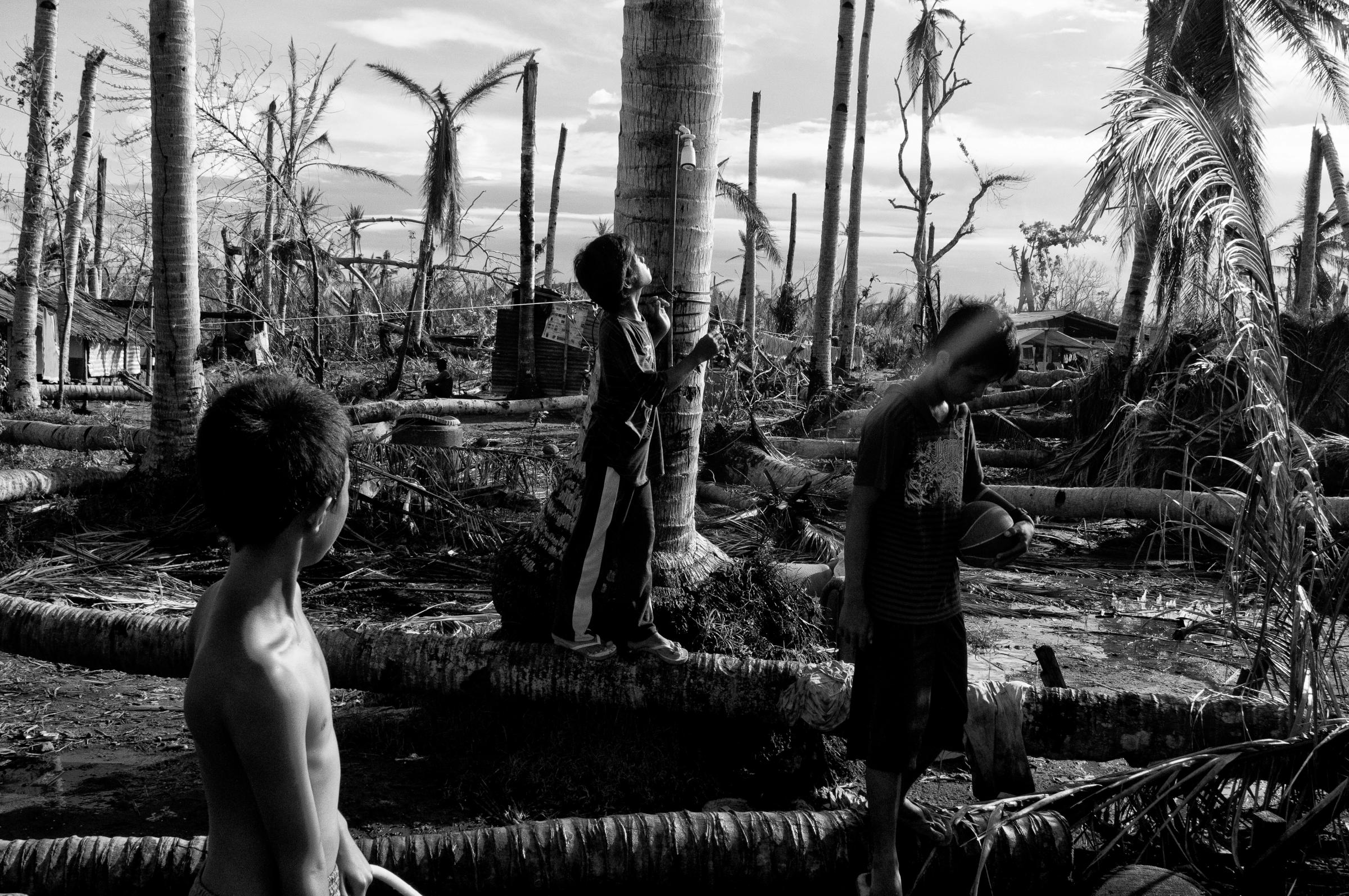 Children play in a damaged village in San Joaquin, Leyte on Dec. 10, 2013.a