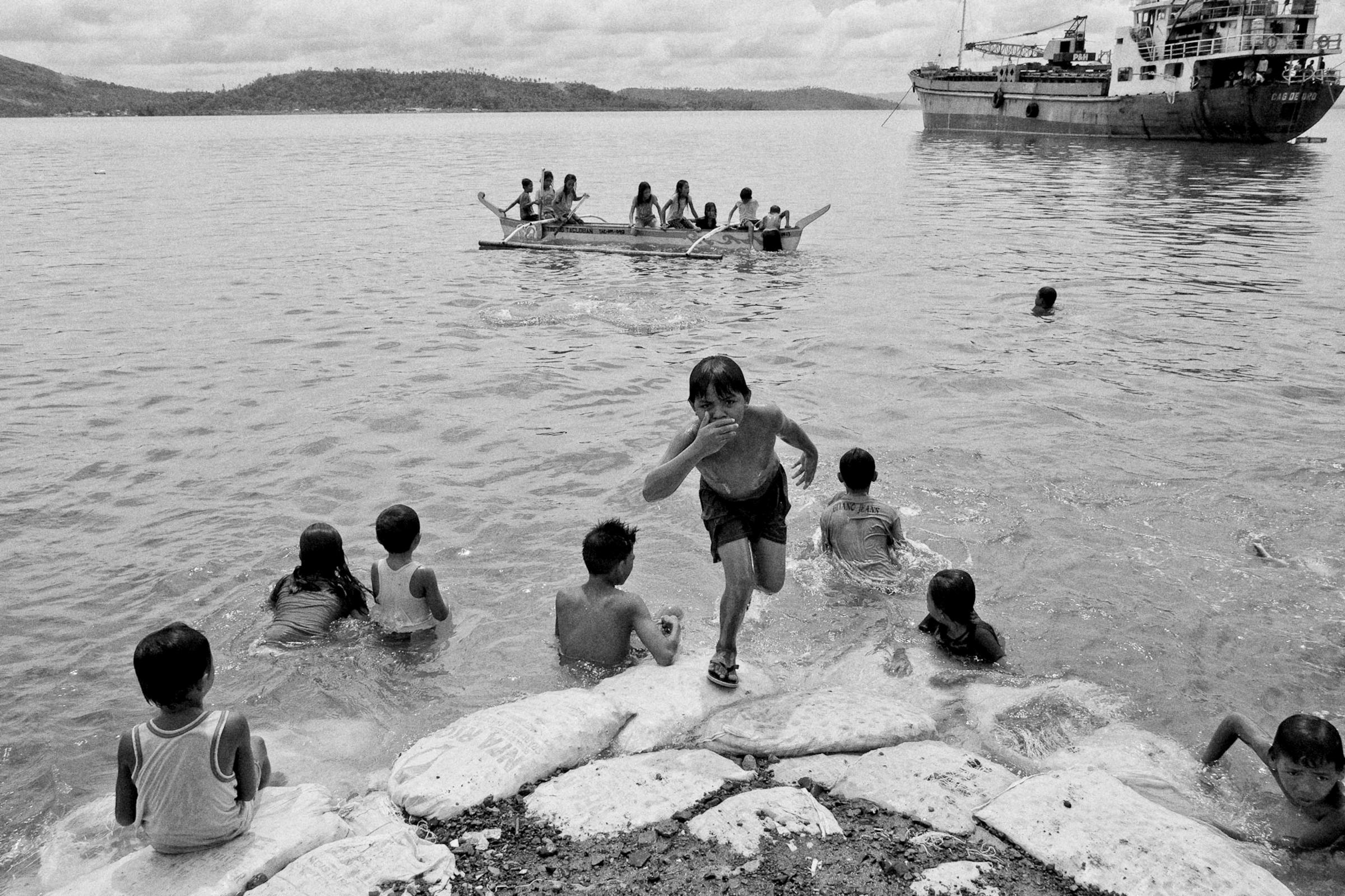 Children take a dip along the coast of Leyte on June 30, 2014.