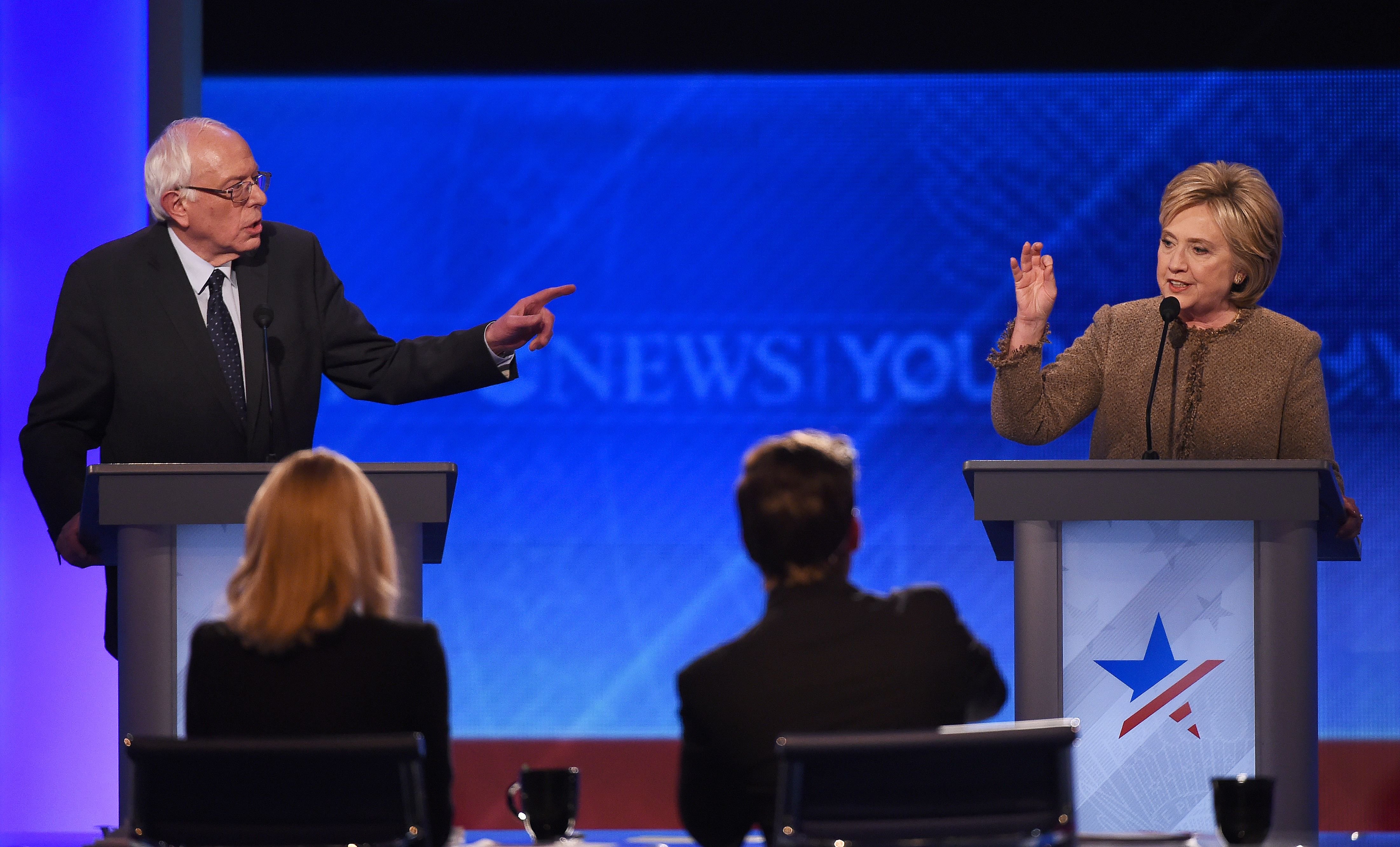 Hillary Clinton, right, and Bernie Sanders participate in the Democratic Presidential Debate hosted by ABC News at Saint Anselm College in Manchester, New Hampshire, on Dec. 19, 2015. (Jewel Samad—AFP/Getty Images)