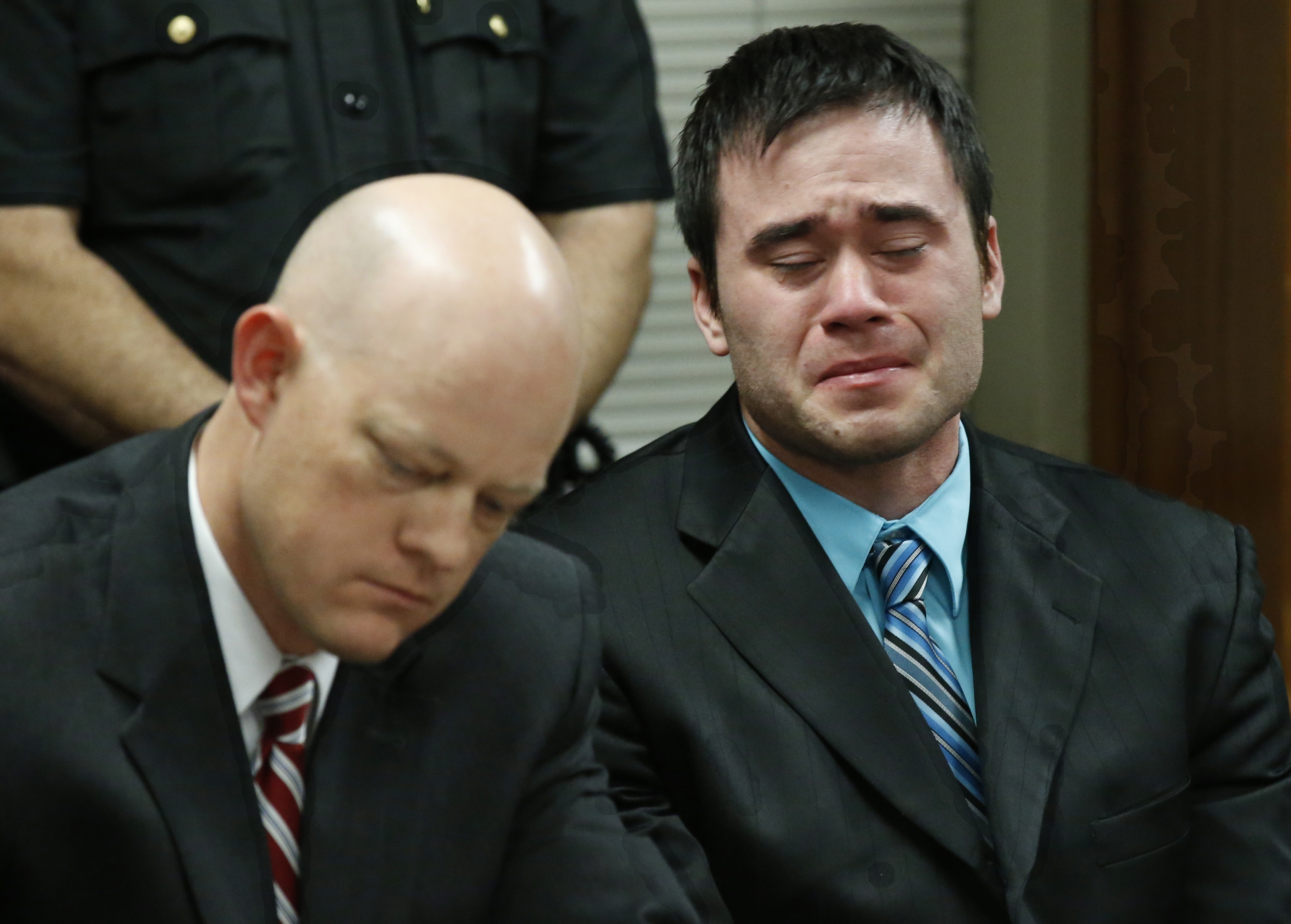 Daniel Holtzclaw, right, cries as the verdicts are read in his trial in Oklahoma City on Dec. 10, 2015. (Sue Ogrocki—AP)