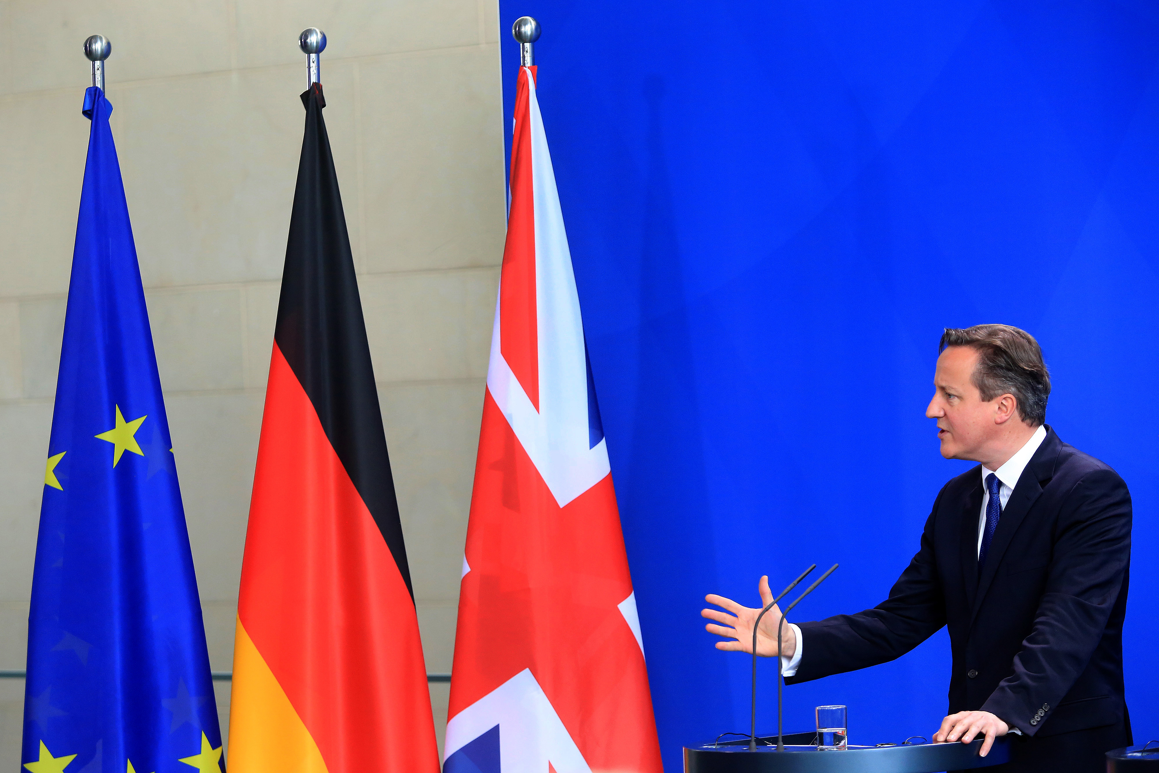 David Cameron, U.K. prime minister, gestures as he speaks during a news conference at the Chancellery in Berlin, Germany, on Friday, May 29, 2015. Chancellor Angela Merkel offered to help Cameron secure the changes he wants to Britain's relationship with the European Union, including the possibility of changing EU treaties if necessary (Bloomberg—Bloomberg via Getty Images)