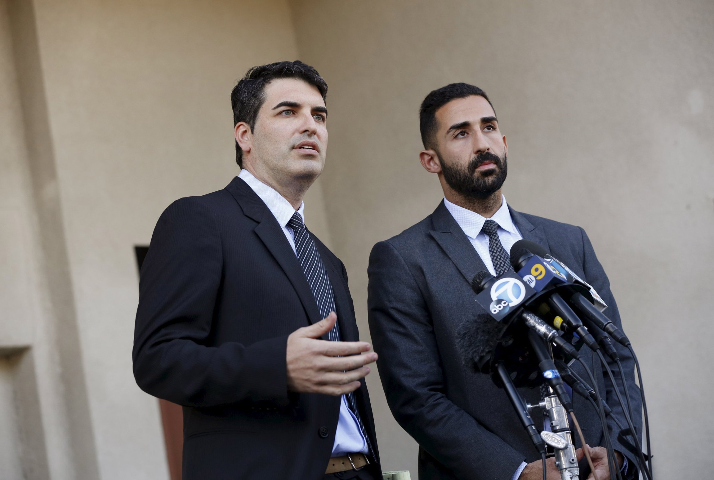 Lawyers representing the Farook family, David S. Chesley and Mohammad Abuershaid (R), speak during a news conference in Los Angeles, California December 4, 2015. The FBI is investigating this week's massacre of 14 people by a married couple in California as an "act of terrorism," officials said on Friday, noting that the female shooter had pledged allegiance to a leader of the militant group Islamic State. REUTERS/Patrick T. Fallon TPX IMAGES OF THE DAY