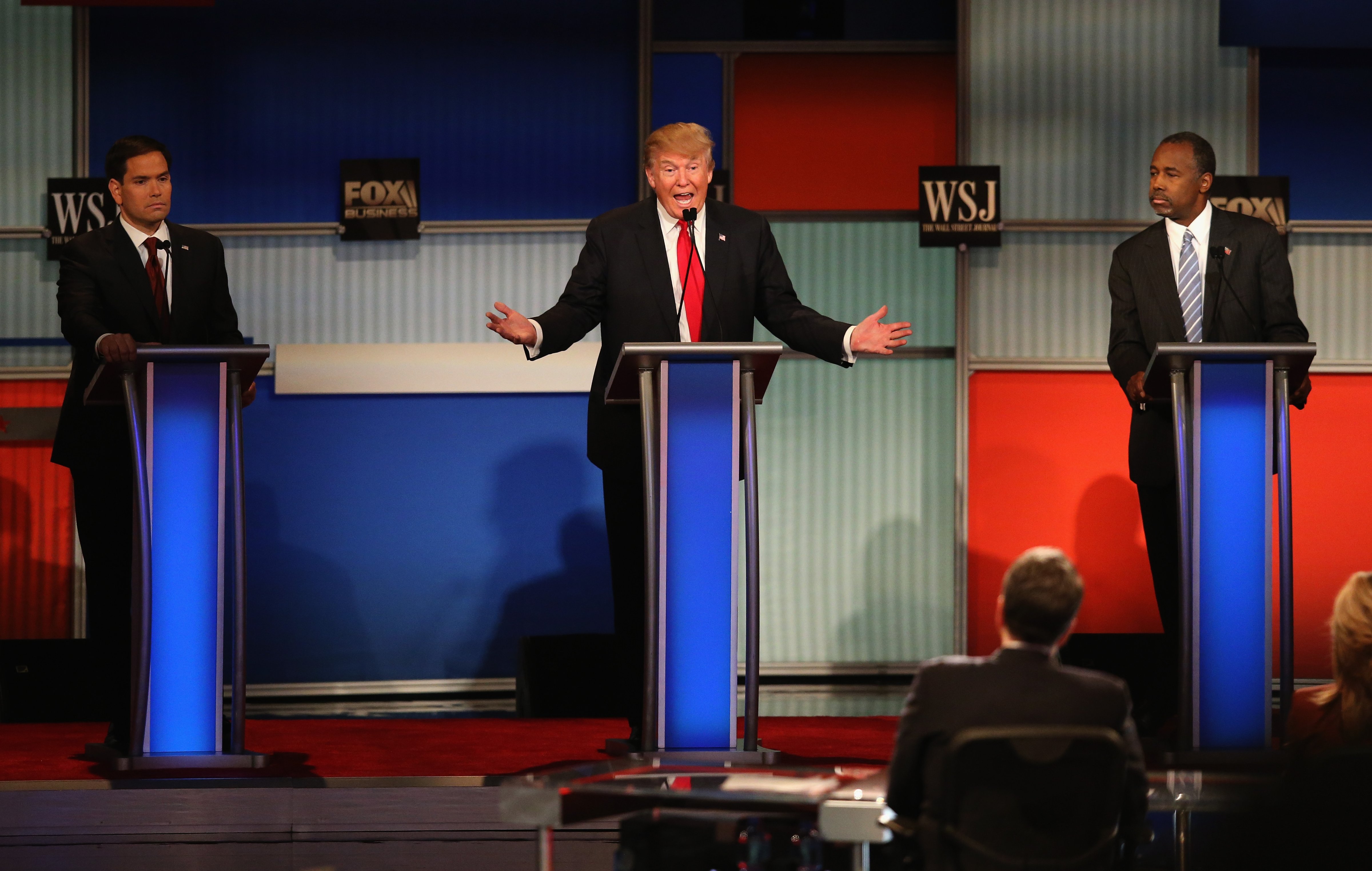 Presidential candidate Donald Trump (C) speaks while Sen. Marco Rubio (L) (R-FL), and Ben Carson look on during the Republican Presidential Debate sponsored by Fox Business and the Wall Street Journal in Milwaukee, Wisc., on Nov. 10, 2015. (Scott Olson—Getty Images)