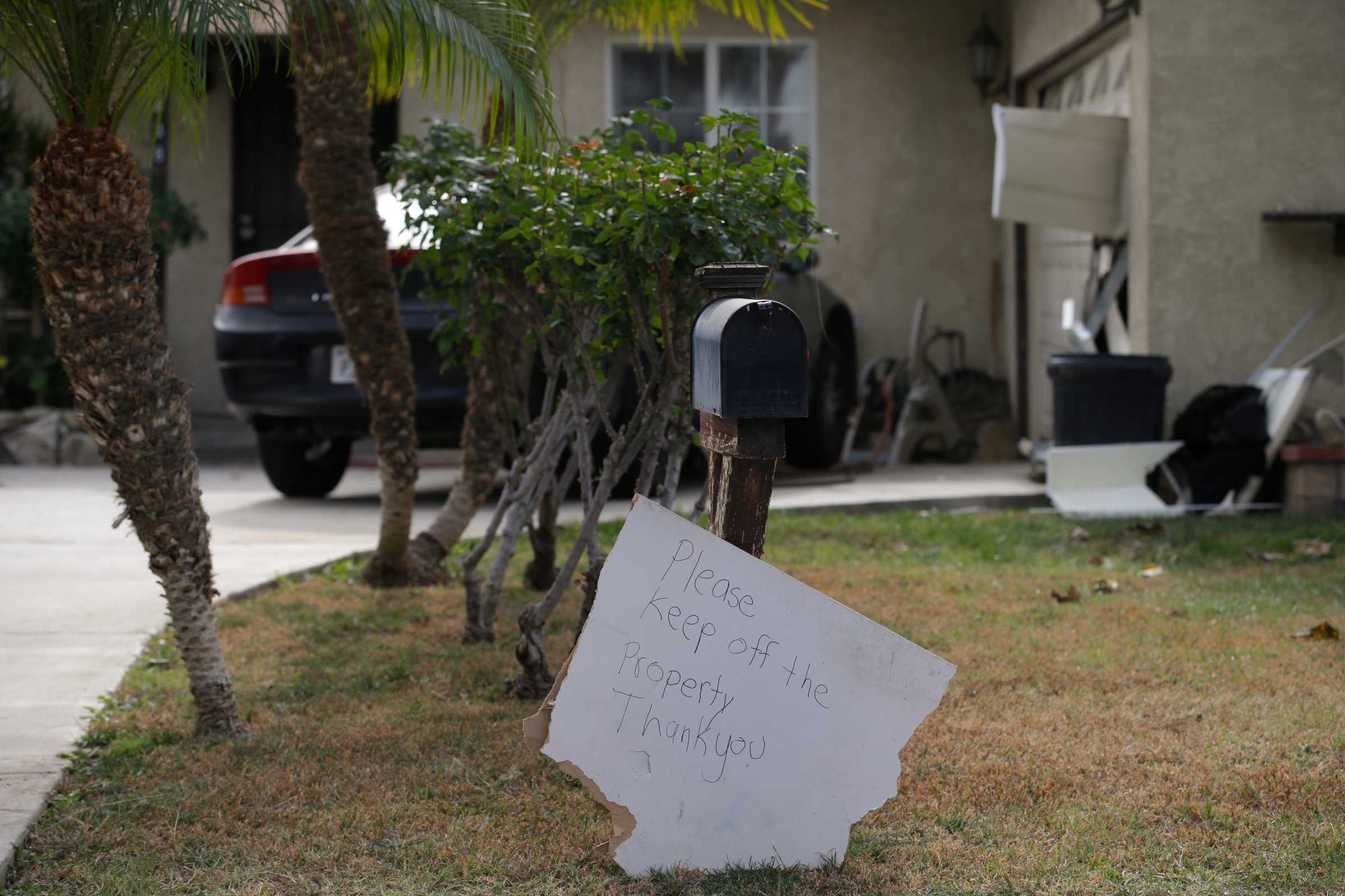 A sign stands in front of a mailbox at Enrique Marquez's home in Riverside, Calif. on Dec. 9, 2015.