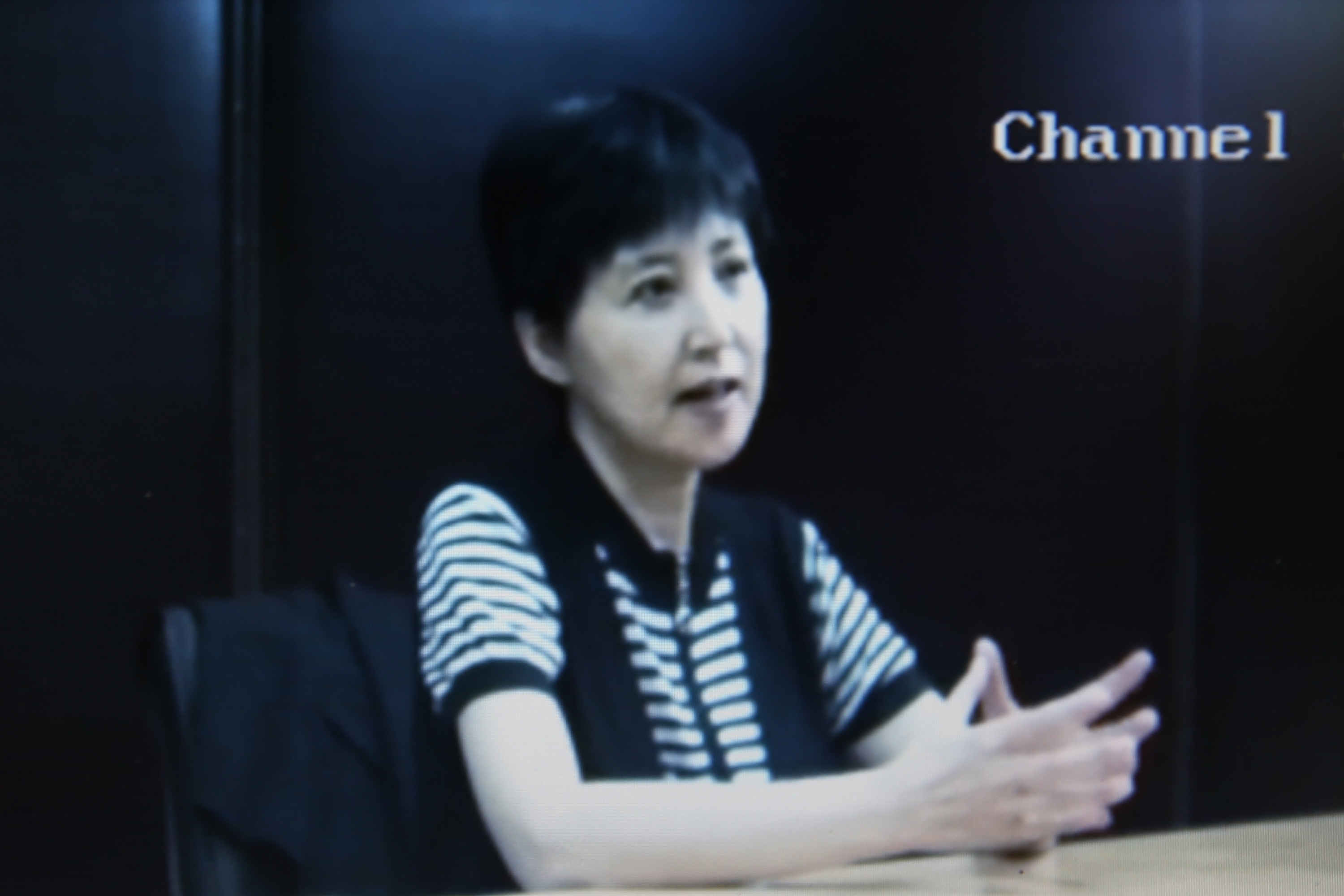 A screen grab shows a video of Gu Kailai, wife of ousted Chinese Communist Party Politburo member Bo Xilai, at the media room for Bo's trial on Aug. 23, 2013, in Jinan, China (Feng Li—Getty Images)