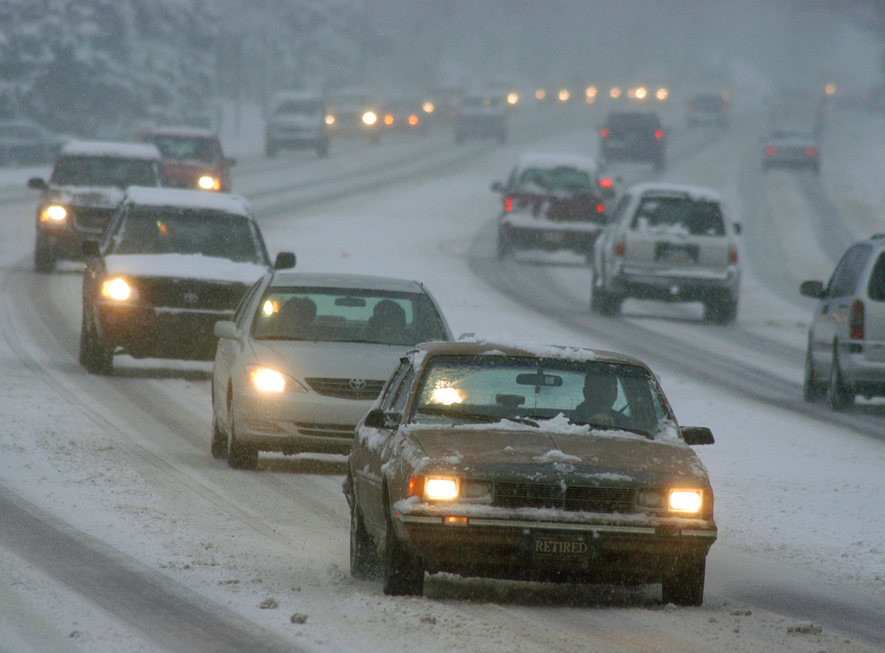 Drivers slowly navigate an icy Route 611 December 5, 2003 in Warrington, Pennsylvania. (William Thomas Cain&mdash;Getty Images)