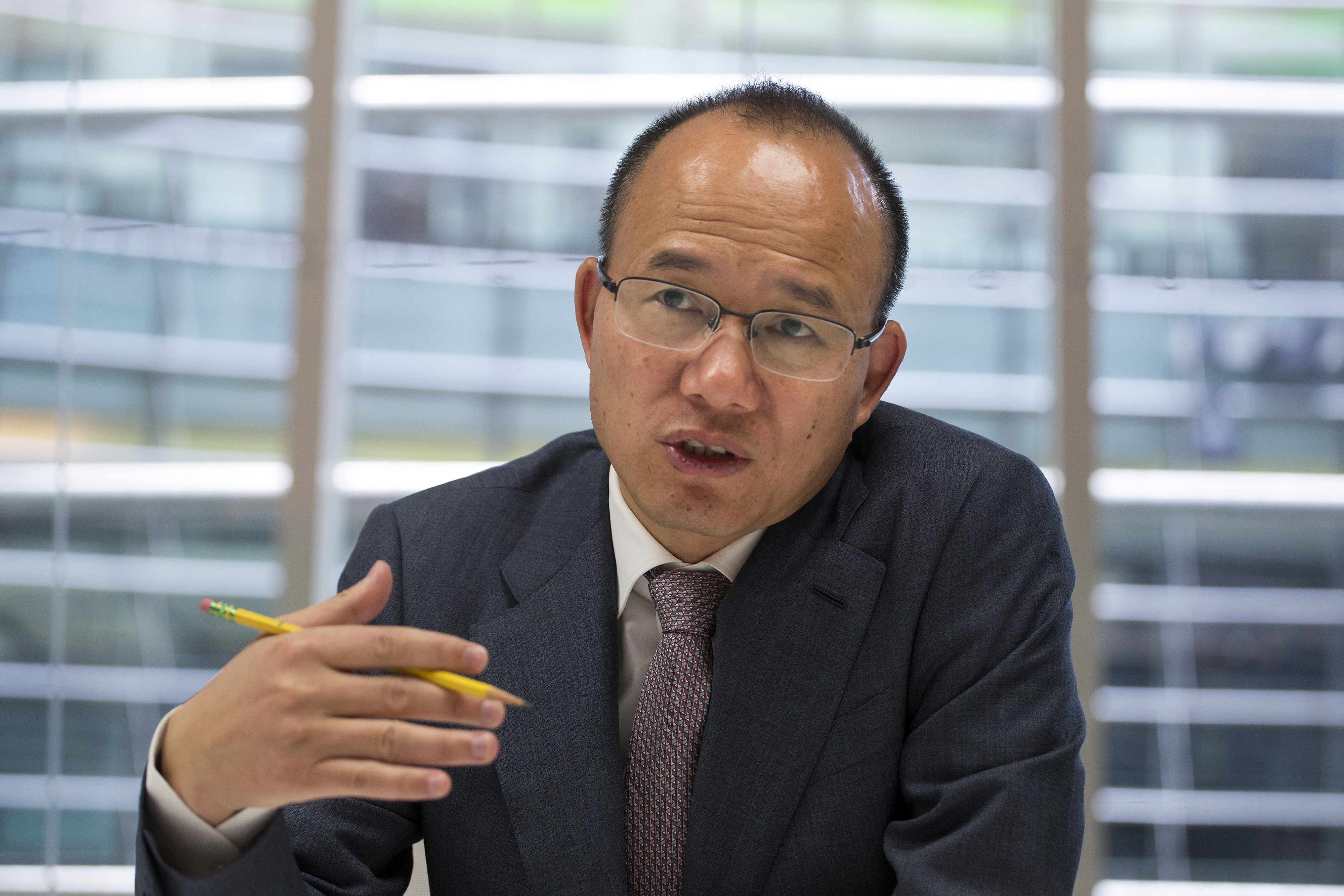 Billionaire Guo Guangchang, chairman and chief executive officer of Fosun Group, speaks during an interview in New York City on April 23, 2015 (Michael Nagle—Bloomberg/Getty Images)