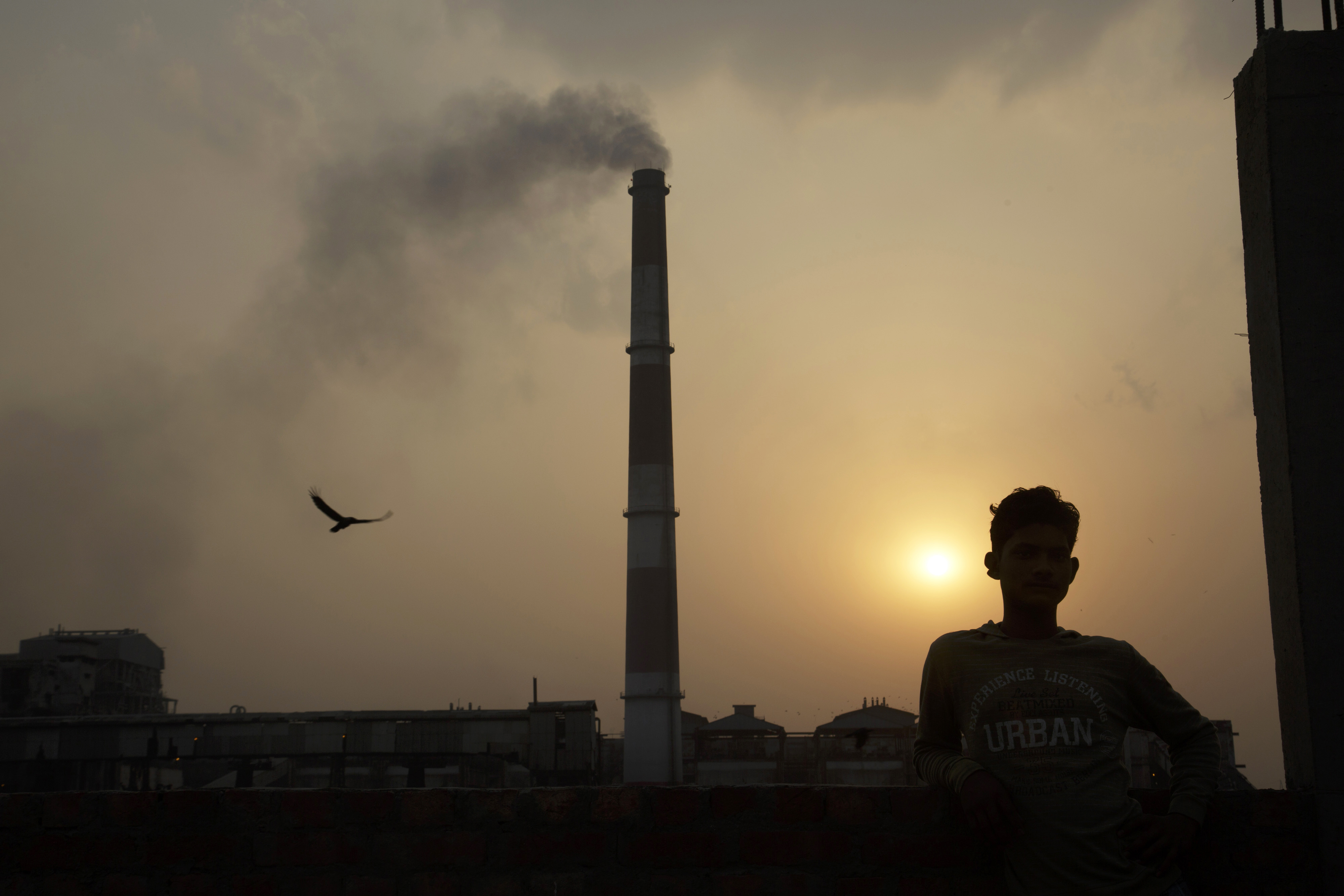 Emissions billow from smokestacks at the NTPC Ltd. Badarpur coal-fired power plant as the sun sets in Badarpur, Delhi, India, on Tuesday, April 28, 2015. (Bloomberg—Bloomberg via Getty Images)