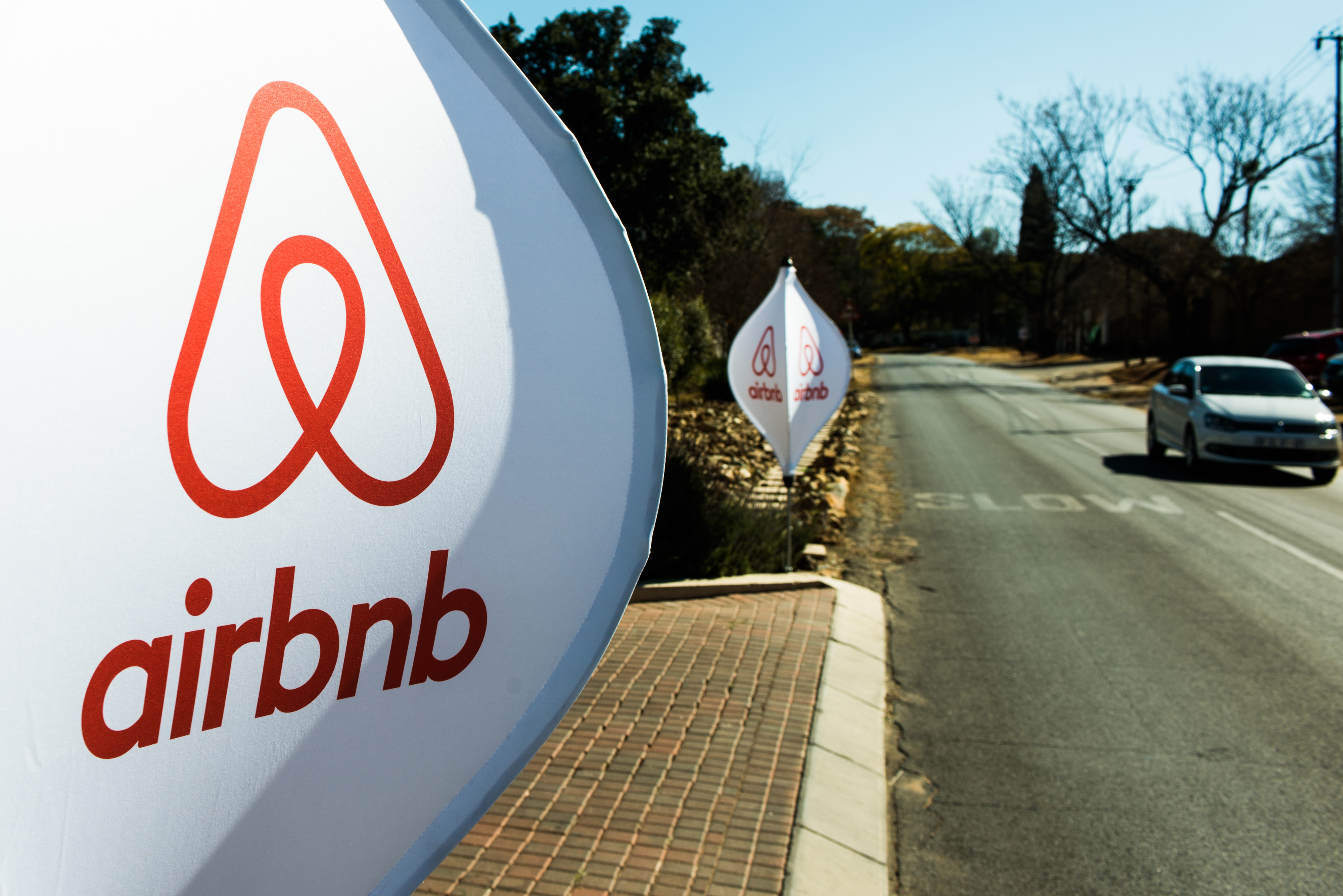 The logos of Airbnb sit on banners displayed outside a media event in Johannesburg on July 27, 2015 (Waldo Swiegers)