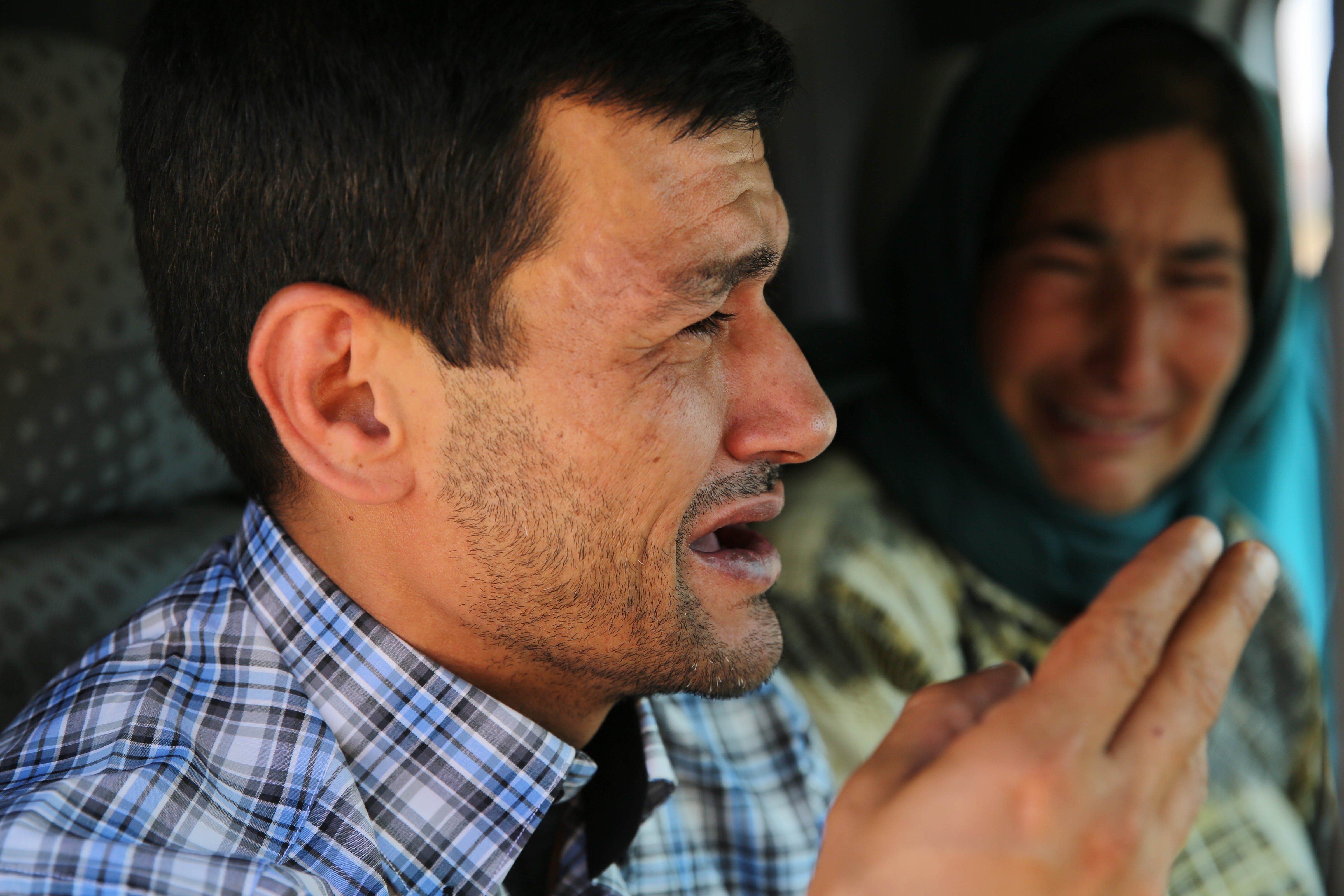 Abdullah Kurdi, father of Syrian children Aylan, 2, his brother Galip, 3, and husband of Zahin Kurdi, 27, who drowned after their boat sank en route to the Greek islands in the Aegean Sea, cries on his way to the Syrian border town of Kobani (Ayn al-Arab) to hold funeral of his family on September 4, 2015. The 12 people, including eight children, drowned after their boat sank en route to the Greek islands in the Aegean Sea. (Anadolu Agency—Getty Images)