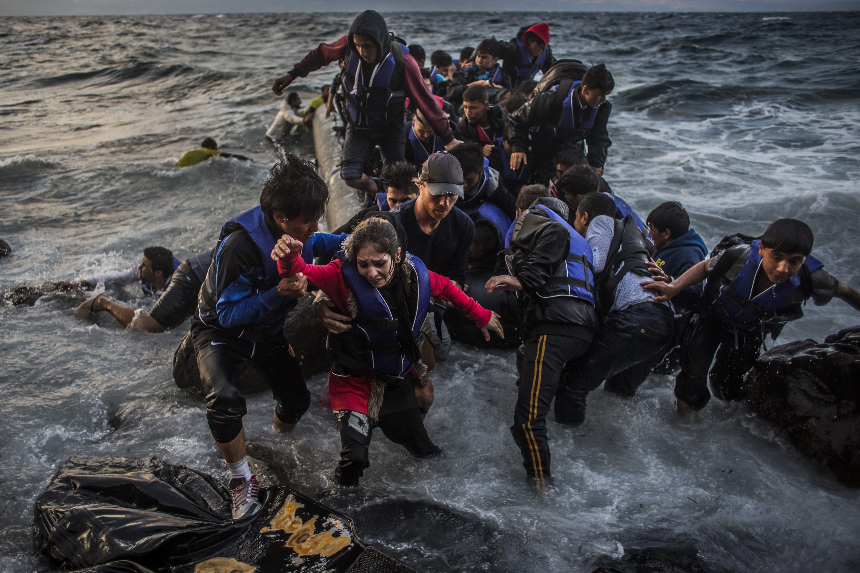Refugees arrive on the shores of the Greek island of Lesbos, near Skala Sikaminias village, Greece, on Oct. 1, 2015, after crossing the Aegean Sea from Turkey on an inflatable boat (Matej Divizna—Getty Images)
