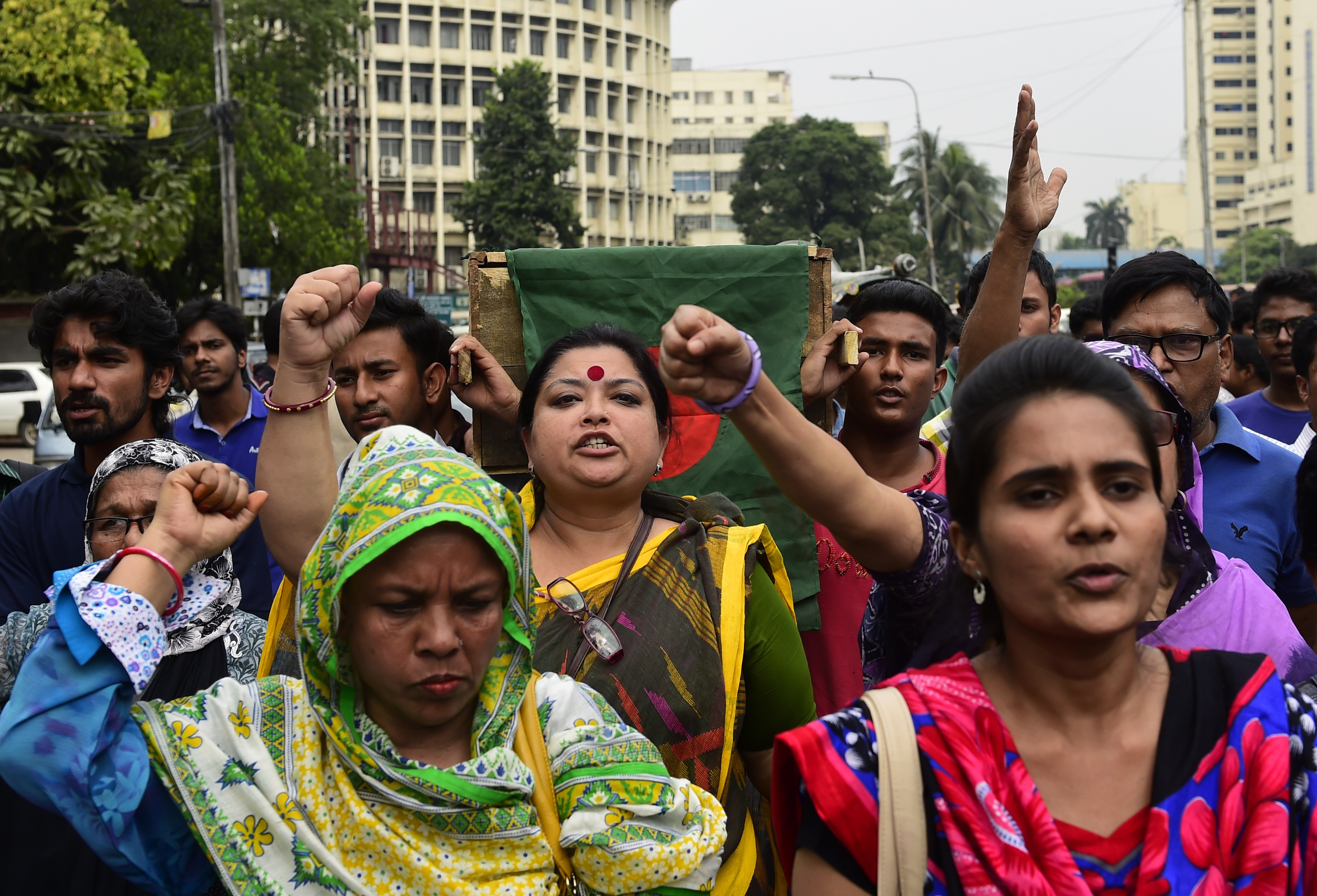Bangladeshi activists shout slogans as they march in the street with mock coffins, which symbolize the deaths of secular publishers and bloggers, in Dhaka on Nov. 5, 2015 (Munir Uz Zaman—AFP/Getty Images)