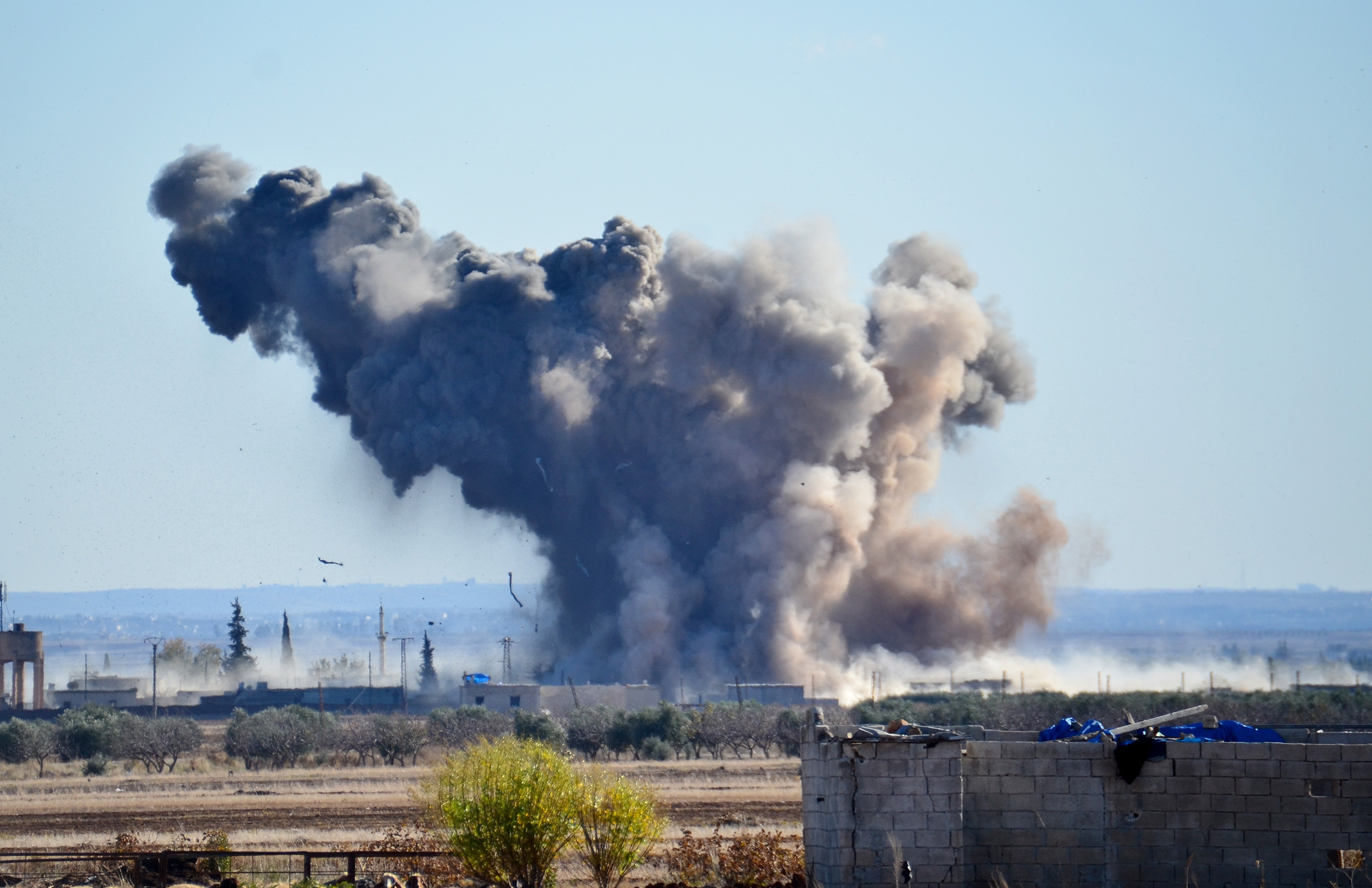 Smoke rises after the U.S.-led coalition air strikes hit ISIS positions at Brekida village in Aleppo, Syria, on Dec. 3, 2015 (Anadolu Agency—Getty Images)