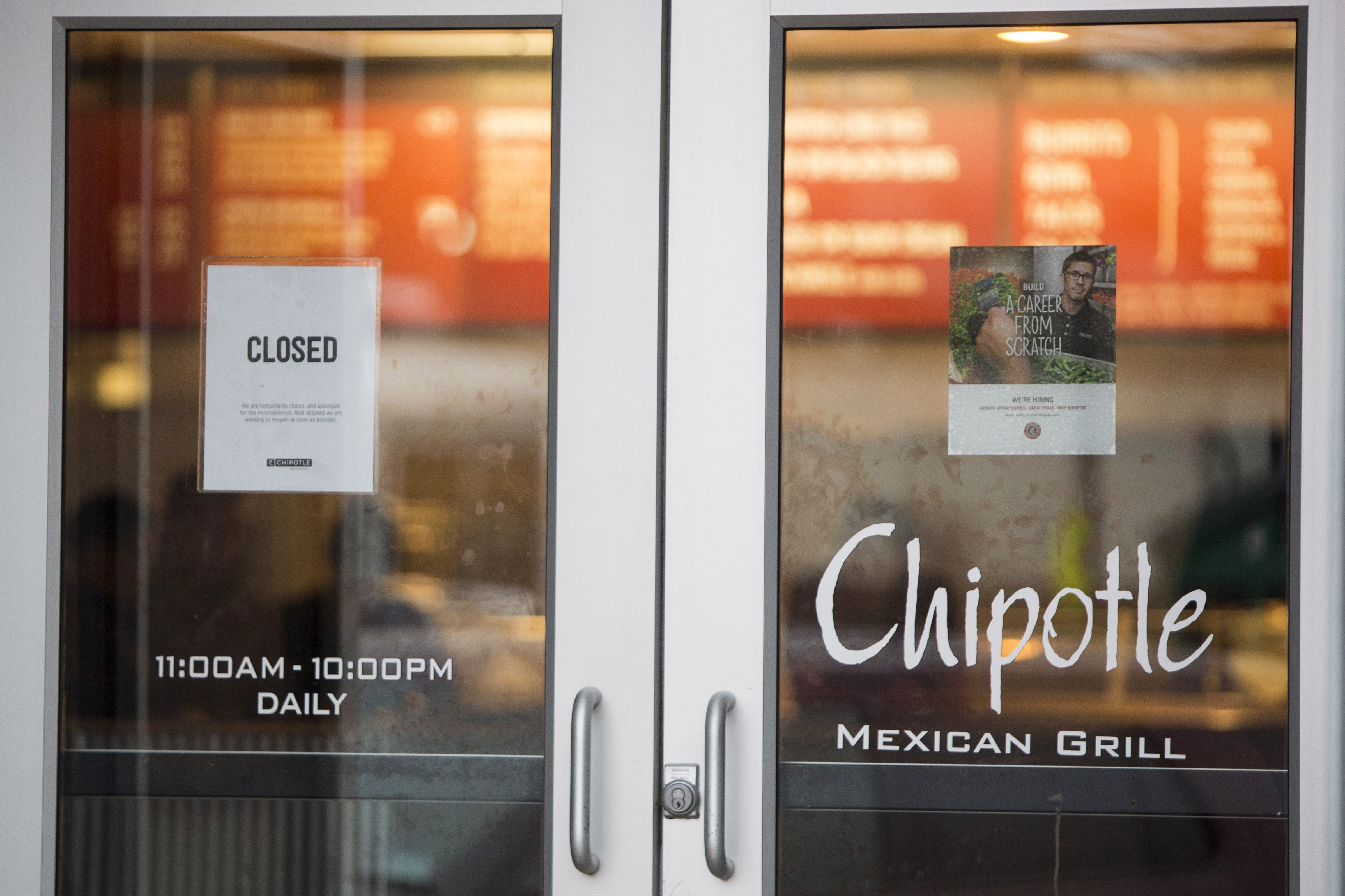 A sign showing that the Chipotle Mexican Grill seen at 1924 Beacon St. is closed on December 8, 2015 in Boston, Massachusetts. (Scott Eisen&mdash;Getty Images)