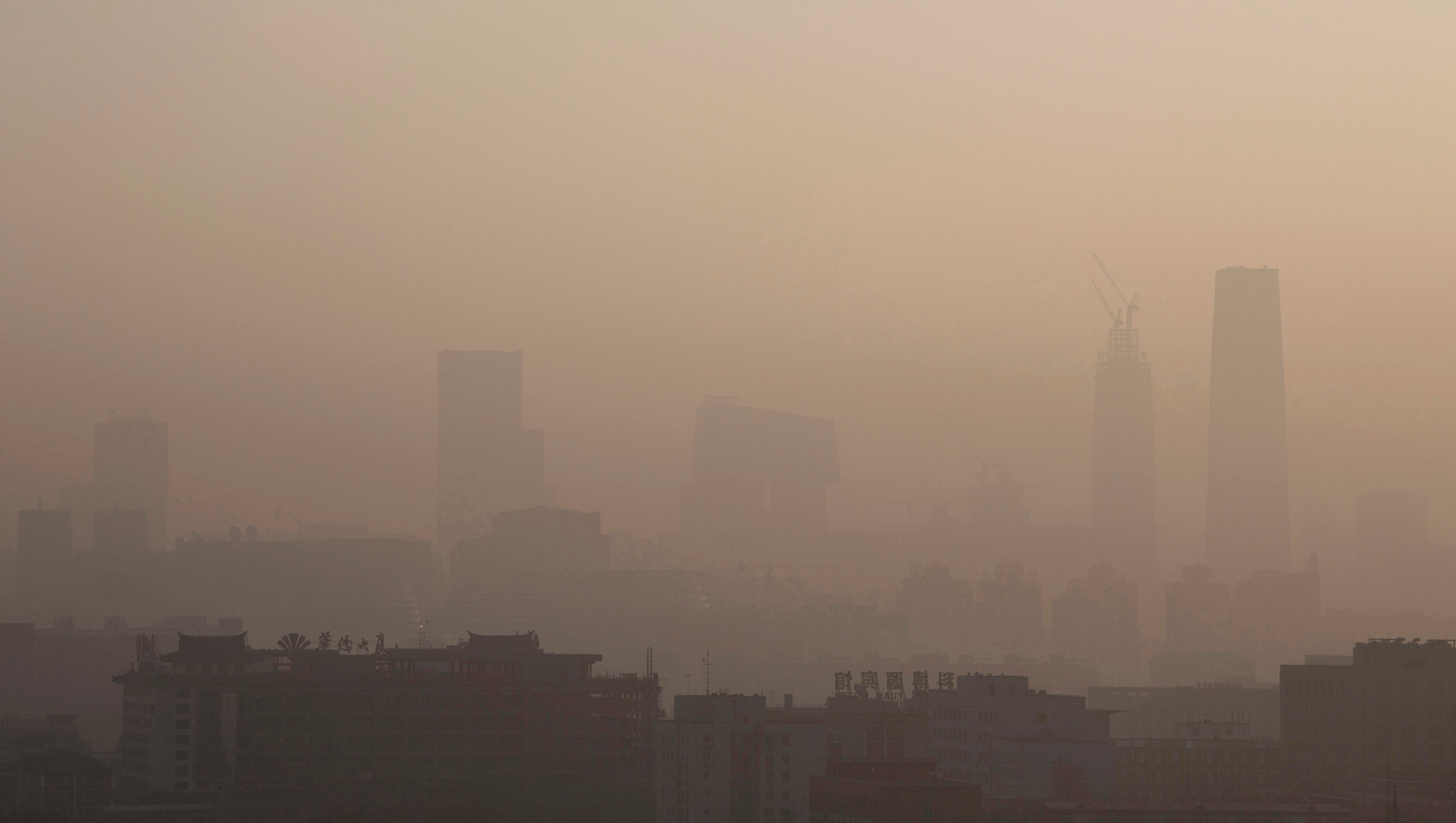 The skyline of Beijing under severe smog and pollution on Dec. 10, 2015 (Kevin Frayer—Getty Images)