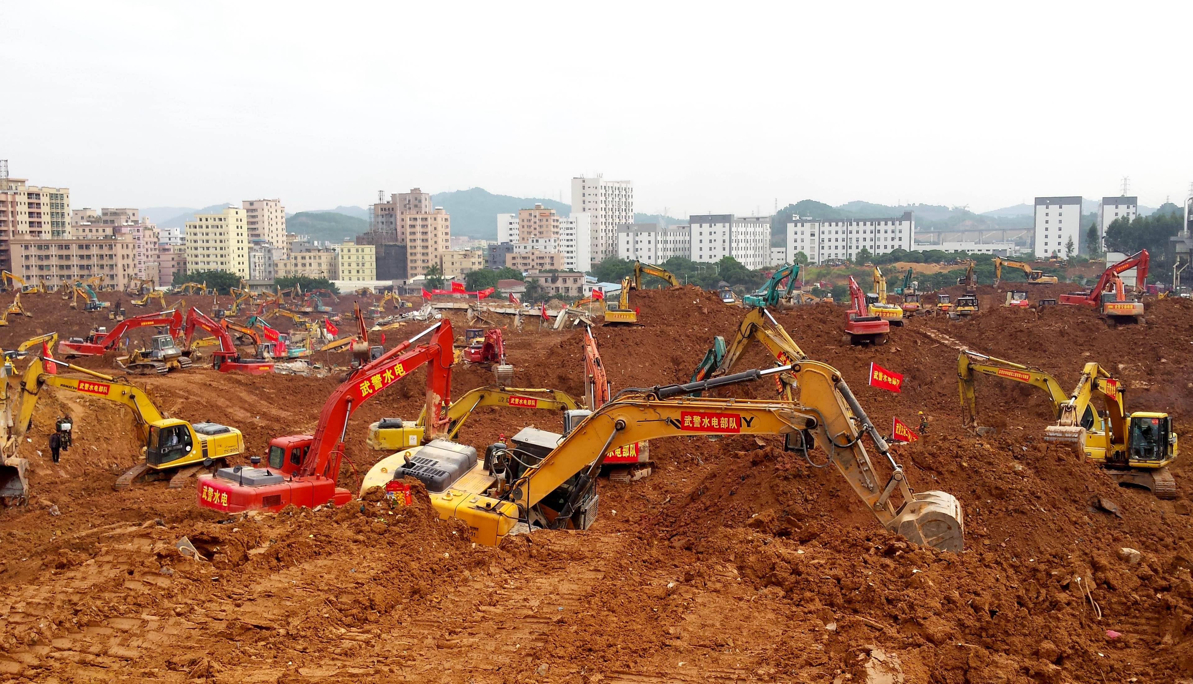 Excavators are seen working at the site of the landslide in an industrial area in Shenzhen, southern China's Guangdong province, on Dec. 28, 2015 (STR—AFP/Getty Images)