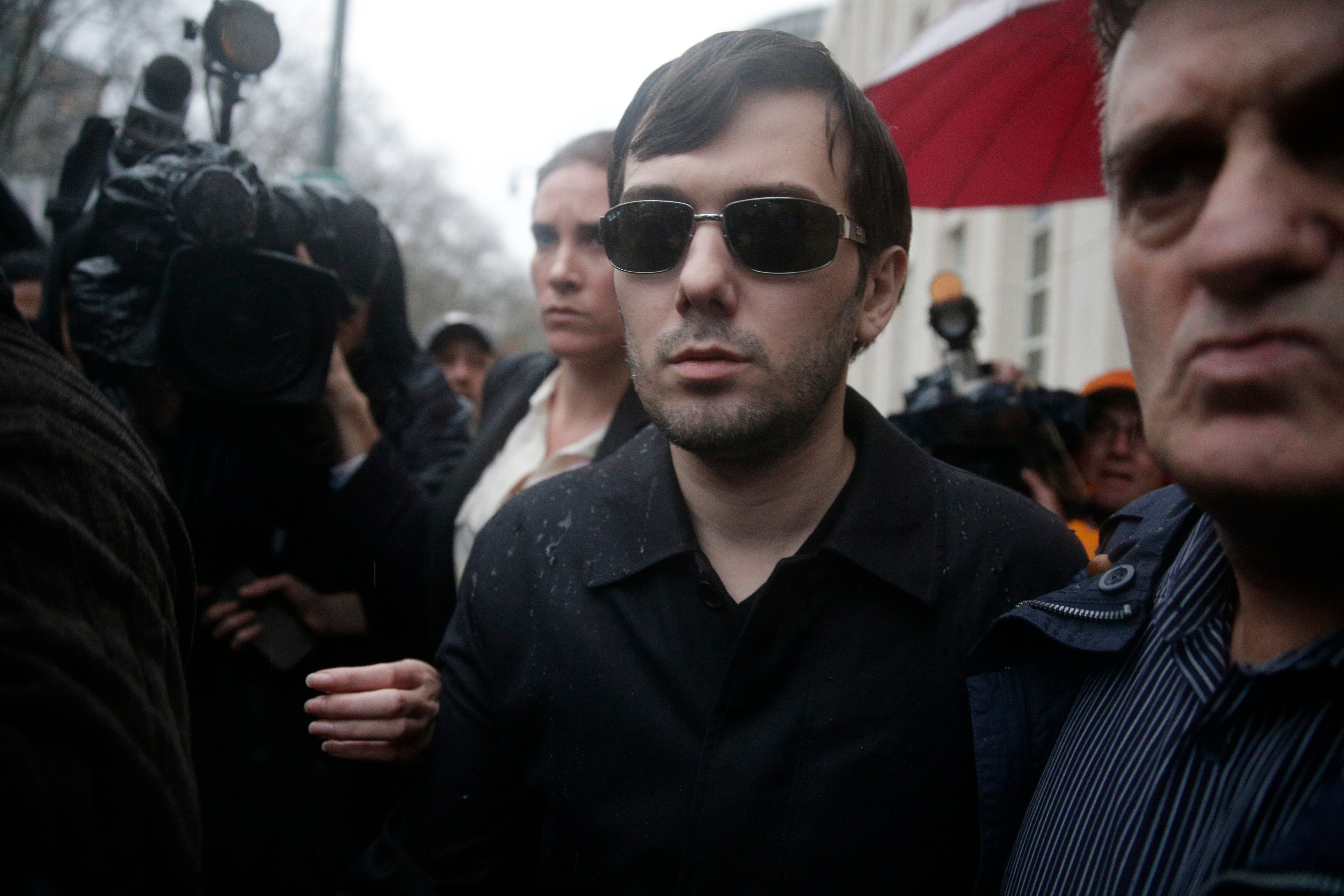 Martin Shkreli, former CEO of Turing Pharmaceuticals, leaves a U.S. Federal courthouse following an arraignment on charges of securities fraud in New York, on Dec. 17, 2015. (Andrew Gombert—EPA)