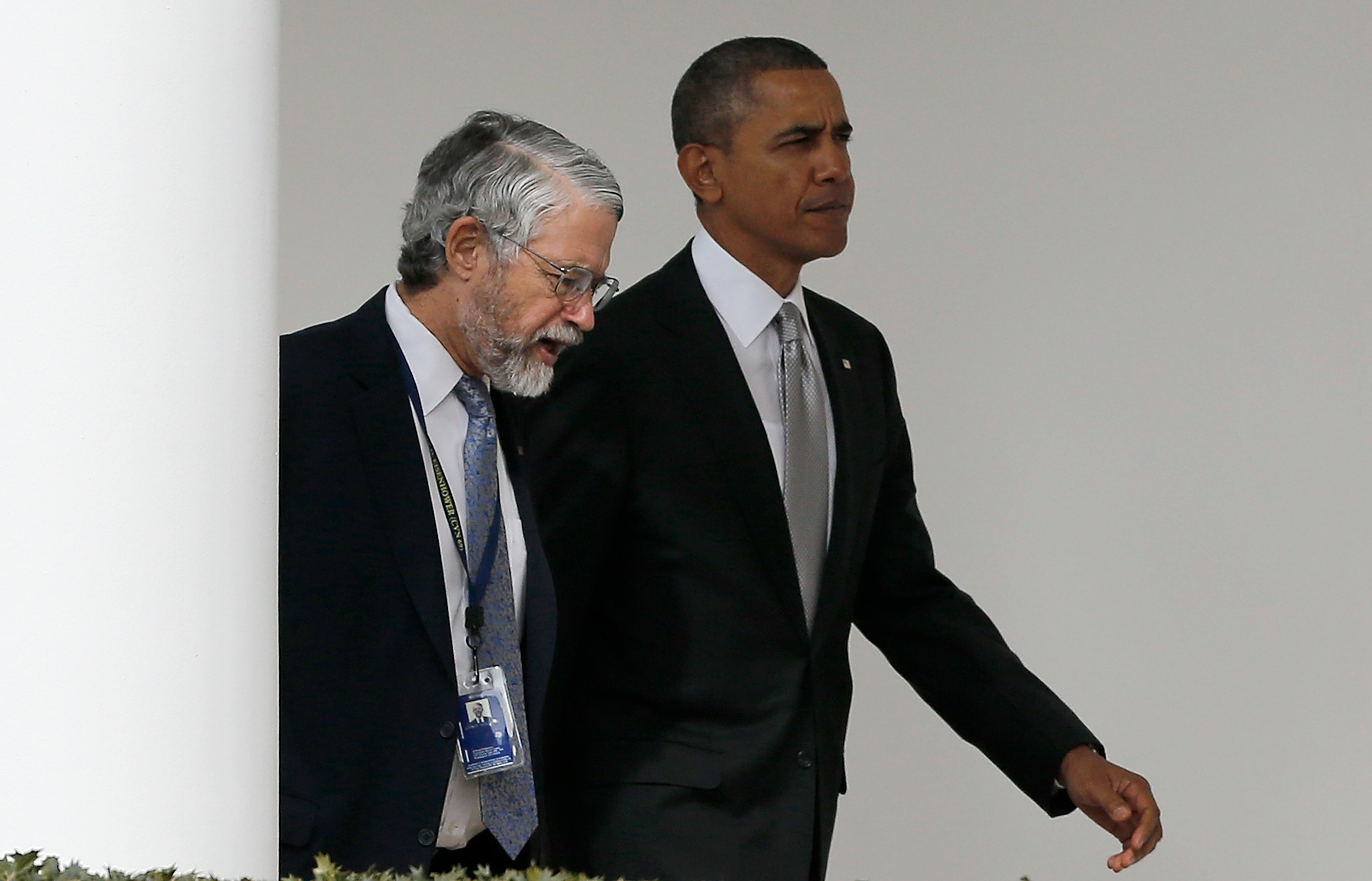 The prez and the professor: Holdren and Obama at the White House, in March. (Win McNamee—Getty Images)