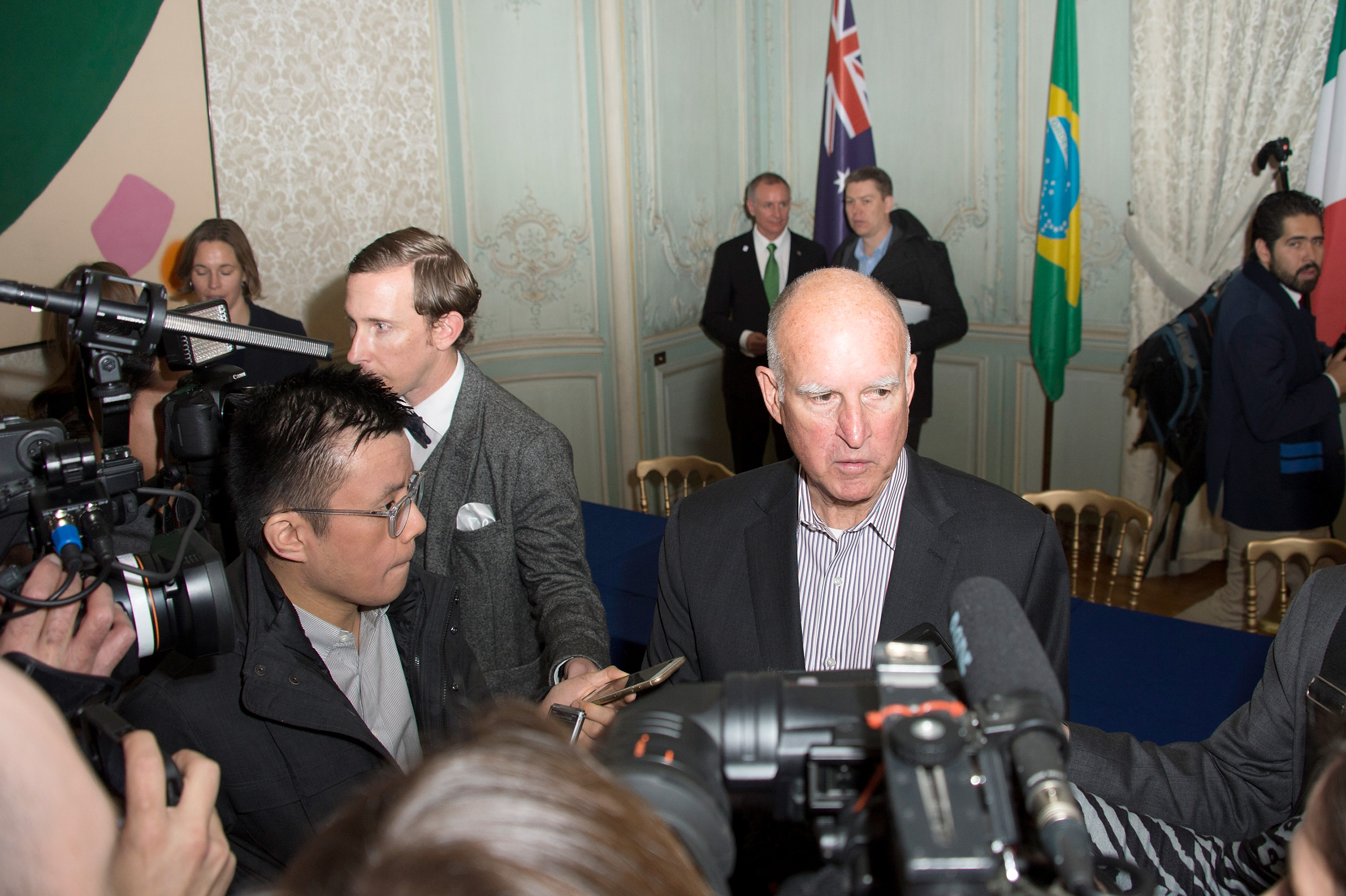 California Governor Jerry Brown speaks to the press after the signing of the memorandum on subnational global climate leadership on Dec. 6, 2015 in Paris. (Aurelien Meunier—Getty Images)