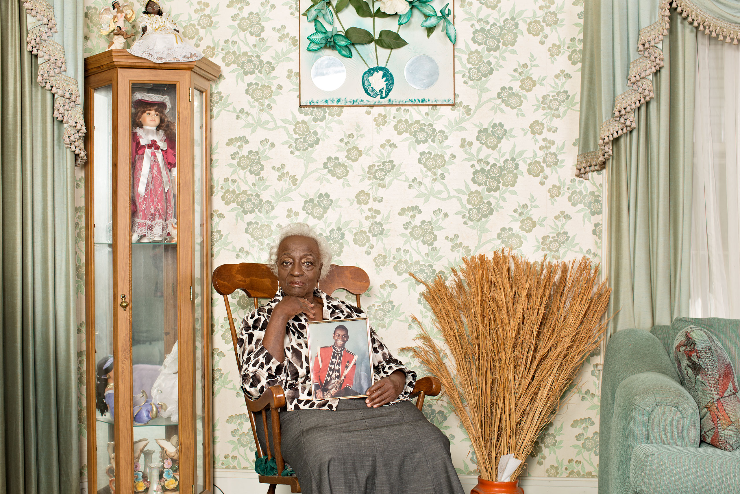 Gracie Broome, the Rev. Clementa Pinckney’s grandmother, at her home in Mullins, S.C., with a photo of him in his school marching-band uniform. “When you hear others forgiving,” she says, “it makes you feel good.”From  Telling Charleston’s Story in Photographs