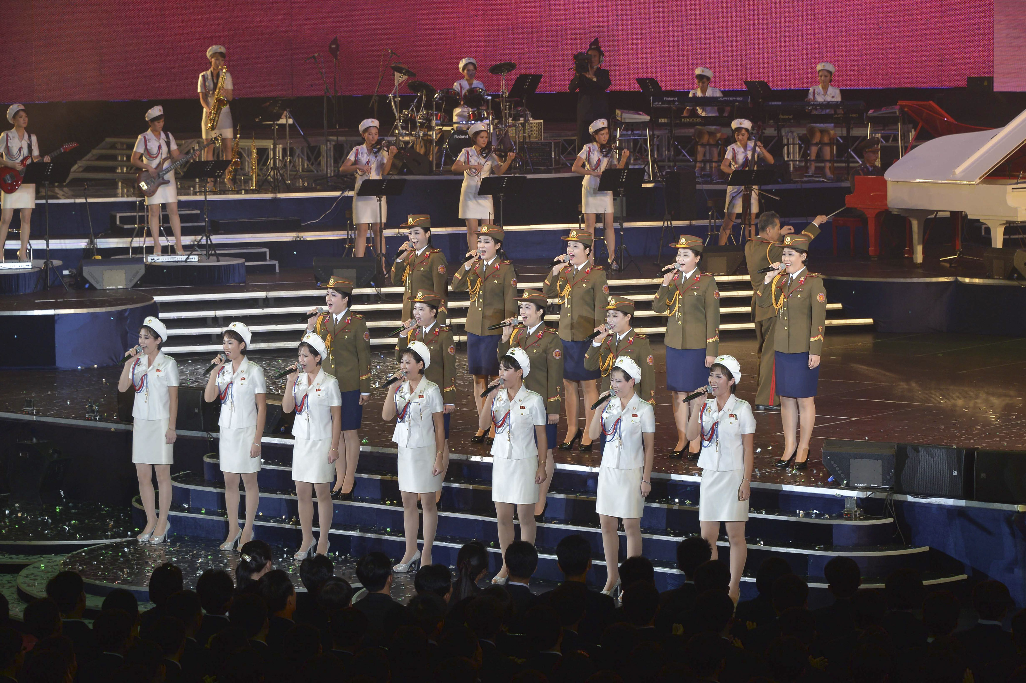 Members of the Moranbong Band and the State Merited Chorus take part in a joint performance to celebrate the 68th anniversary of the Workers' Party of Korea (WPK) in this undated photo released by North Korea's Korean Central News Agency (KCNA) in Pyongyang, Oct. 11, 2013. (KCNA/Reuters)