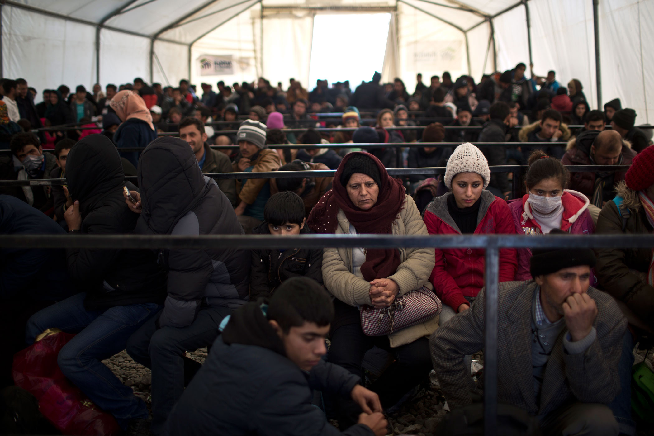The Qasus wait at a registration camp near the southern Macedonian town of Gevgelija to board a train to the Serbian border, Dec. 5, 2015.