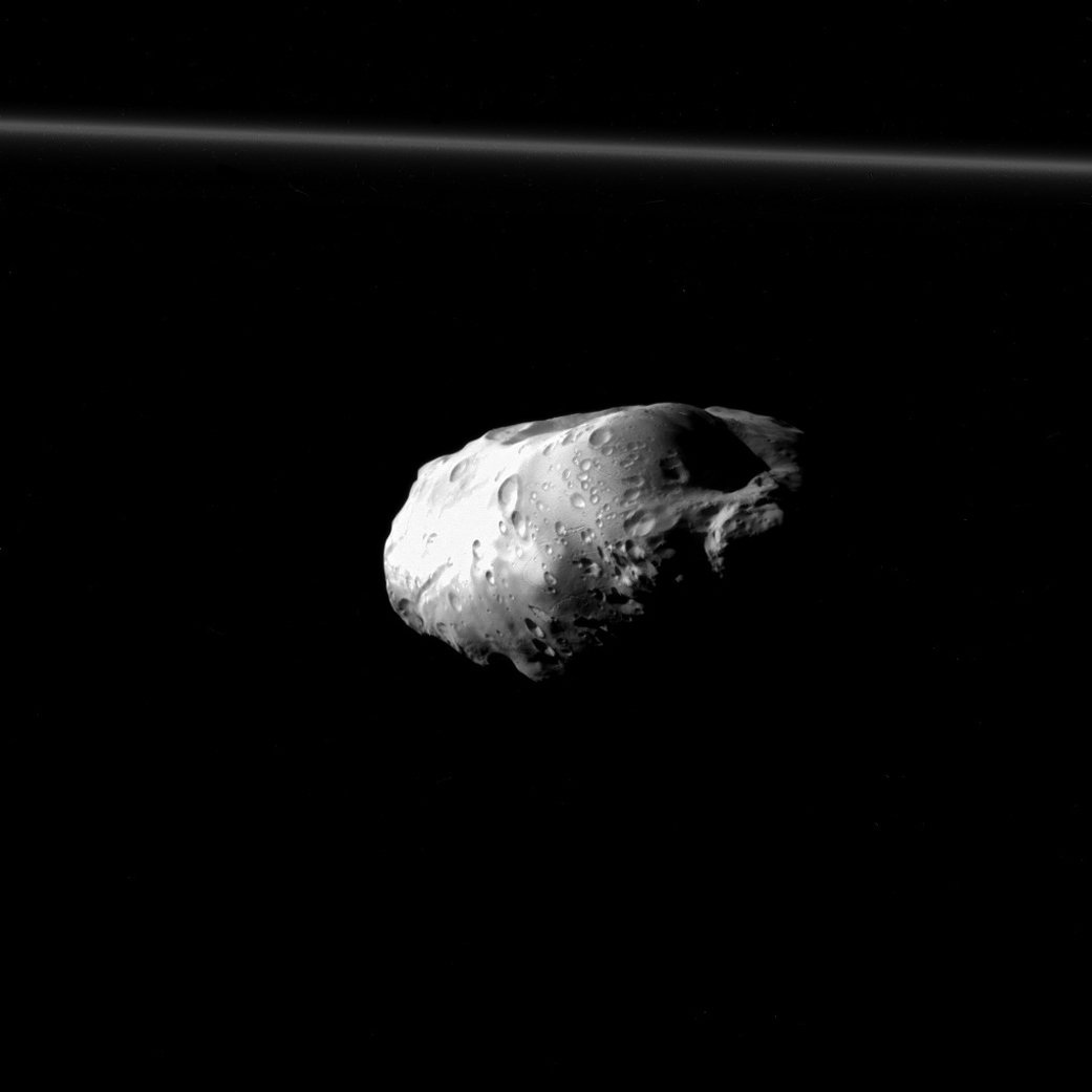 NASA's Cassini spacecraft spied details on the pockmarked surface of Saturn's moon Prometheus (86 kilometers, or 53 miles across) during a moderately close flyby on Dec. 6, 2015. This is one of Cassini's highest resolution views of Prometheus, along with PIA18186 and PIA12593.