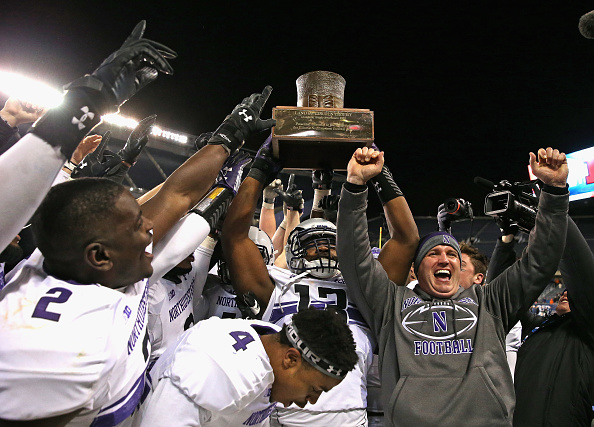 Northwestern celebrates winning  the "Land of Lincoln" trophy after the Wildcats defeated Illinois on November 28, 2015 in Chicago, Illinois. (Jonathan Daniel&mdash;Getty Images)