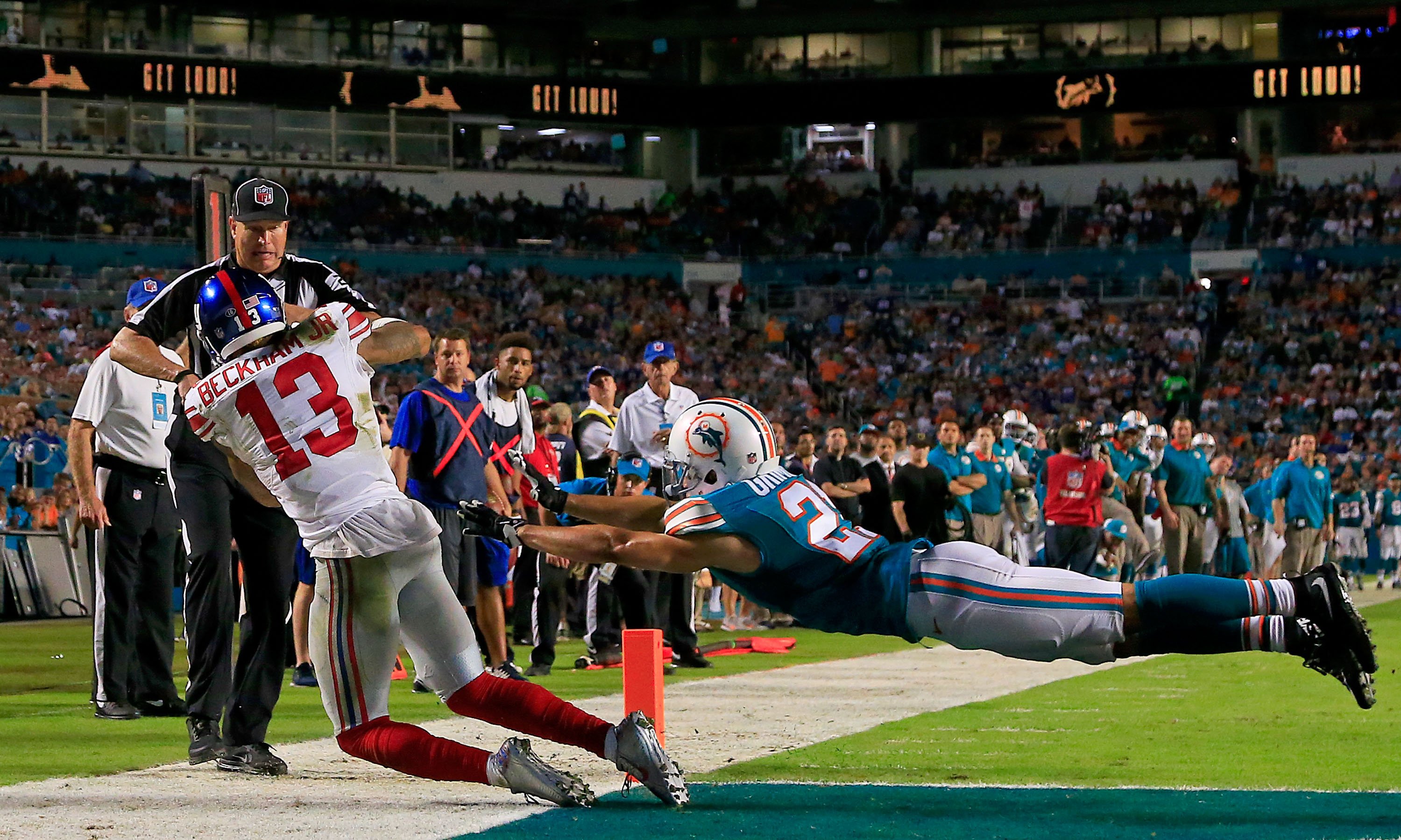 Odell Beckham #13 of the New York Giants catches a touchdown pass as Brent Grimes #21 of the Miami Dolphins defends during the third quarter of the game at Sun Life Stadium on Dec. 14, 2015 in Miami Gardens, Florida. (Chris Trotman—Getty Images)