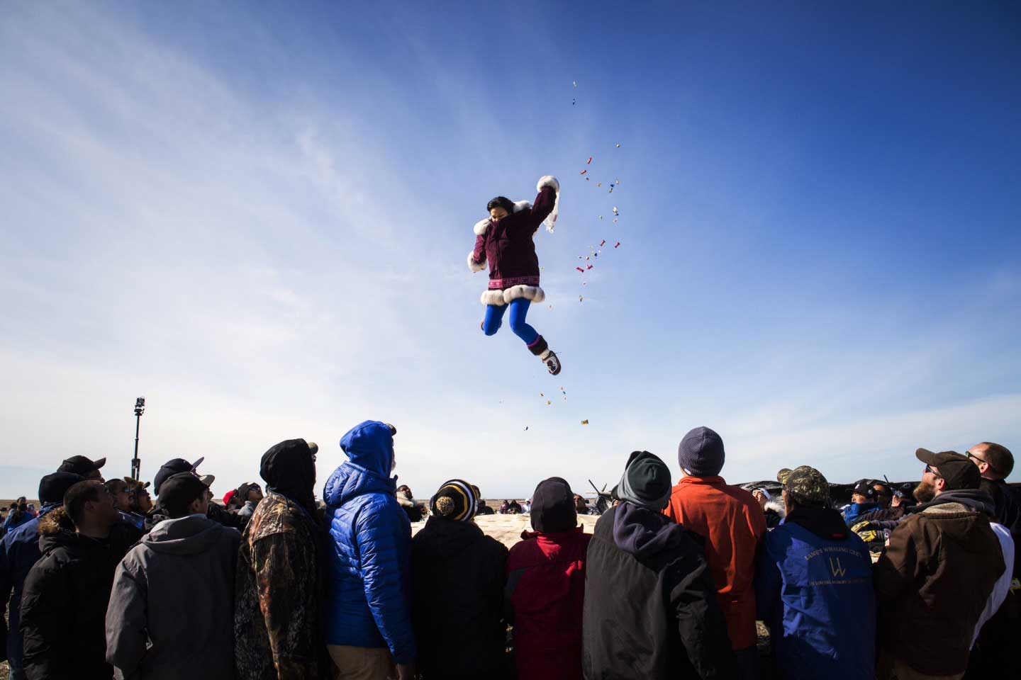 The traditional blanket toss at the annual whaling feast in Point Hope, Alaska on June 16, 2015. For the Inupiat villagers of Point Hope Nothing is more important than the bowhead whale. The calendar year revolves around hunting, fishing and gathering, a lifestyle Alaskans call “subsistence,” which is as much cultural tradition as economic necessity. The entire village looks forward to spring whaling, and celebrates a successful hunt with an annual feast. In recent years, however, the much-anticipated whale hunt has run up against a warming Arctic. Ice is getting thinner, windows of opportunity for hunting are shrinking and animal behavior is changing. Alaska had its hottest year on record in 2014, and for Inupiat villagers in Point Hope who have hunted and foraged their meals for generations, climate change now threatens their way of life.