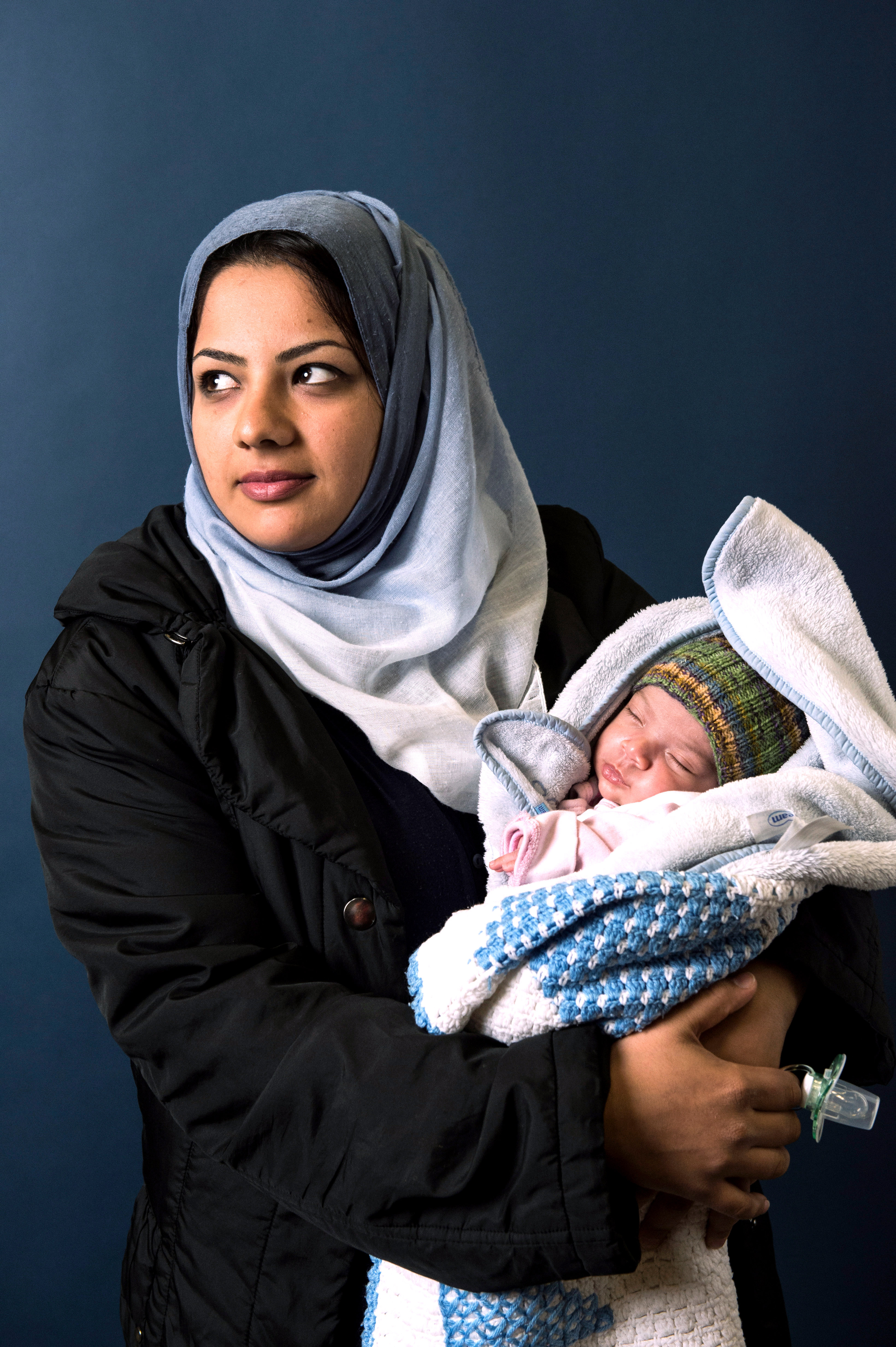 Hind Almahdawi, from Bagdad, poses with her infant daughter, Angela in Sarstedt, Germany on Nov. 4, 2015. (Alexander Koerner—Getty Images)