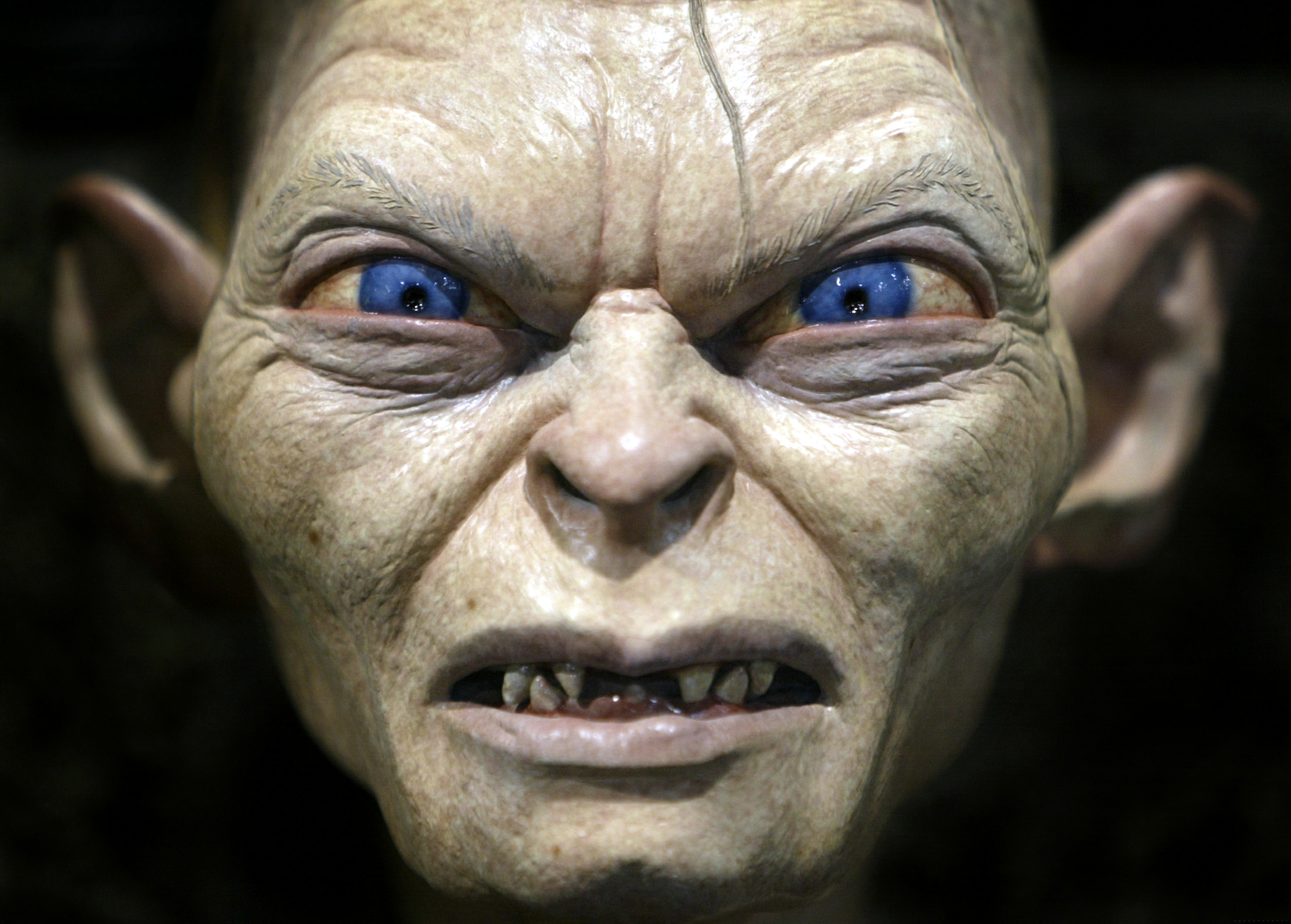 Gollum, a special-effects creature from the movie <i>Lord of the Rings</i>, 
                      is on display at the annual four-day Comic Con convention in San Diego on July 18, 2003. Thousands of fans from around the world gather to peruse
                      a collection of comic books and industry-related sci-fi, video and
                      motion-picture fantasy products (Mike Blake—Reuters)