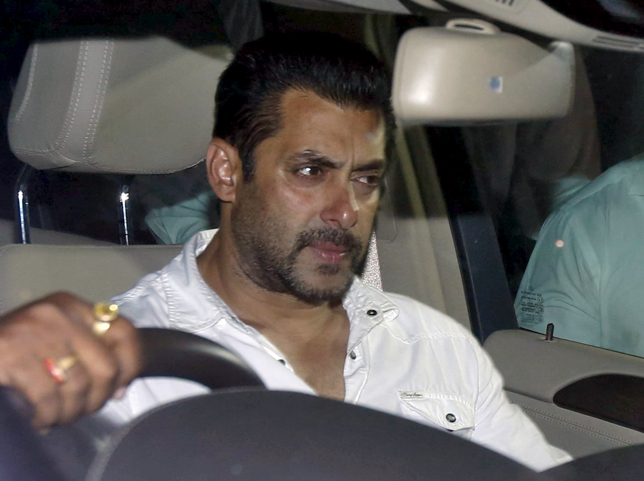 Bollywood actor Salman Khan sits in a car as he leaves a court in Mumbai on May 6, 2015 (Shailesh Andrade—Reuters)