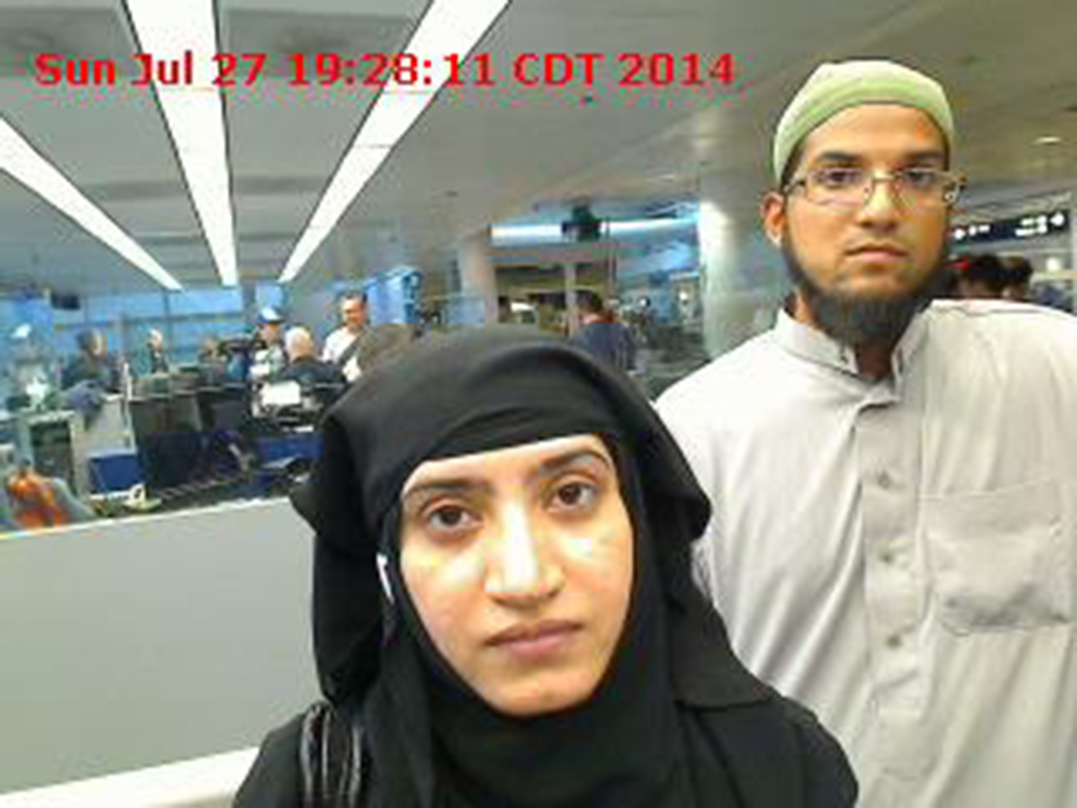 Tashfeen Malik, left, and Syed Rizwan Farook are pictured passing through Chicago's O'Hare International Airport in this July 27, 2014, handout photo obtained by Reuters on Dec. 8, 2015 (US Customs and Border Protection—Handout/Reuters)