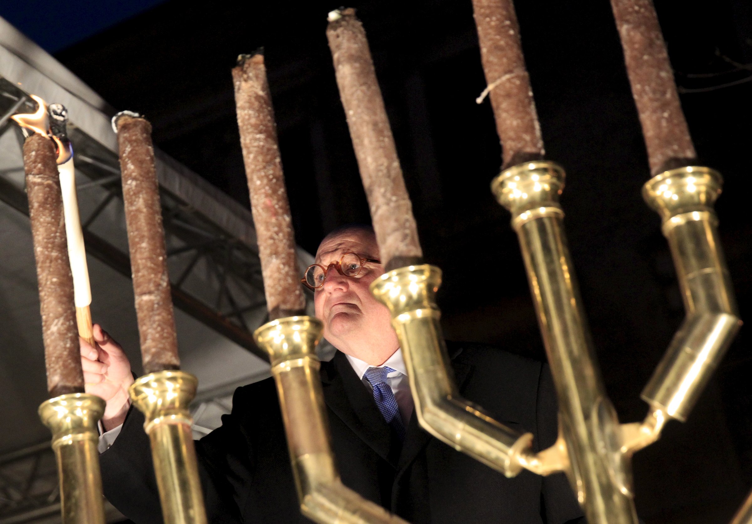 Forman, U.S. Special Envoy of the Office to Monitor and Combat Anti-Semitism, lights a menorah during a protest organised by a Jewish group against a planned statue of Balint Homan in Szekesfehervar