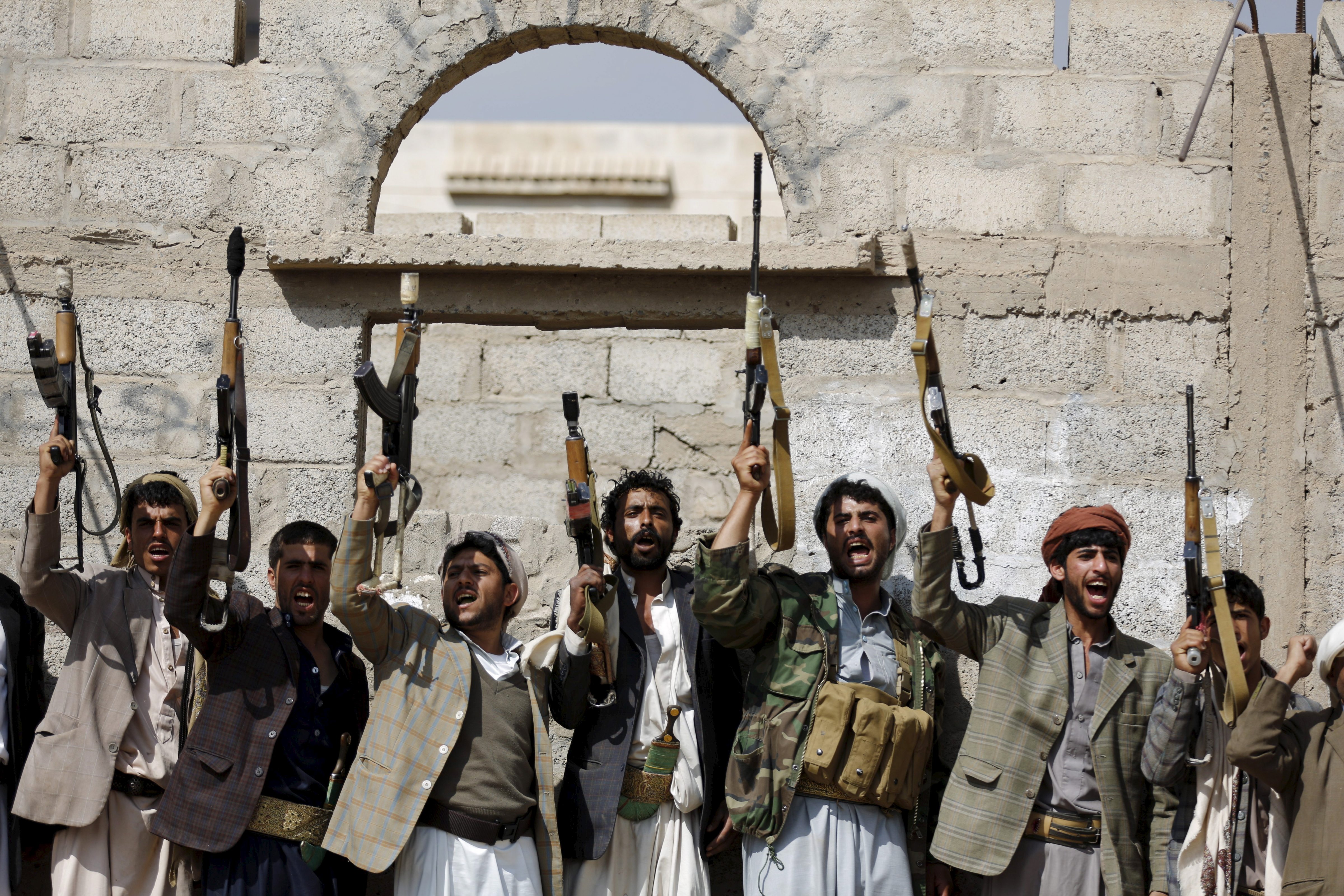Tribesmen loyal to the Houthi movement shout slogans and raise their weapons during a gathering to show their support for the group, in Yemen's capital Sanaa